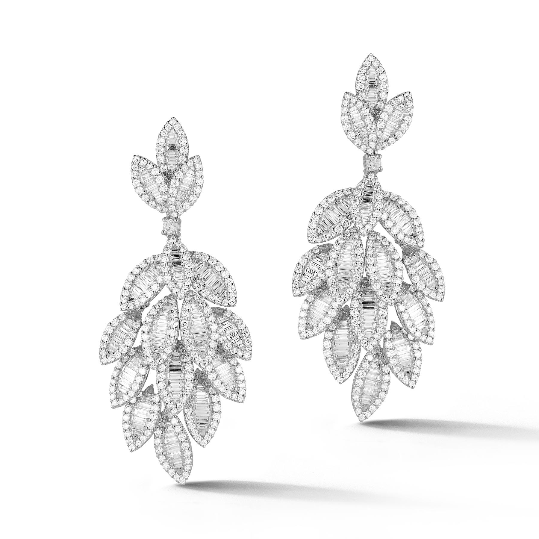 Stunning 18K White Gold Dangle Earrings in Dazzling Leaf-Shapes with 524 White Round Diamonds weighing 5.38 Carats and 207 White Baguette Diamonds weighing 4.56 Carats.