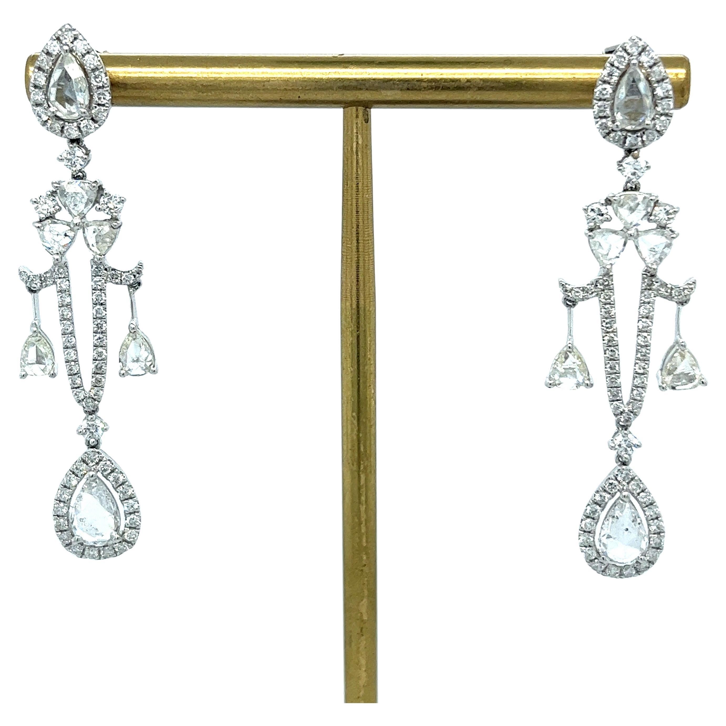 18K White Gold Diamond Droop Earrings

138 Diamonds - 3.82 CT
18K White Gold - 7.76 GM

Adorn yourself with the exquisite elegance of these 18K White Gold Diamond Droop Earrings. Featuring a mesmerizing cascade of 138 diamonds totaling 3.82 CT,