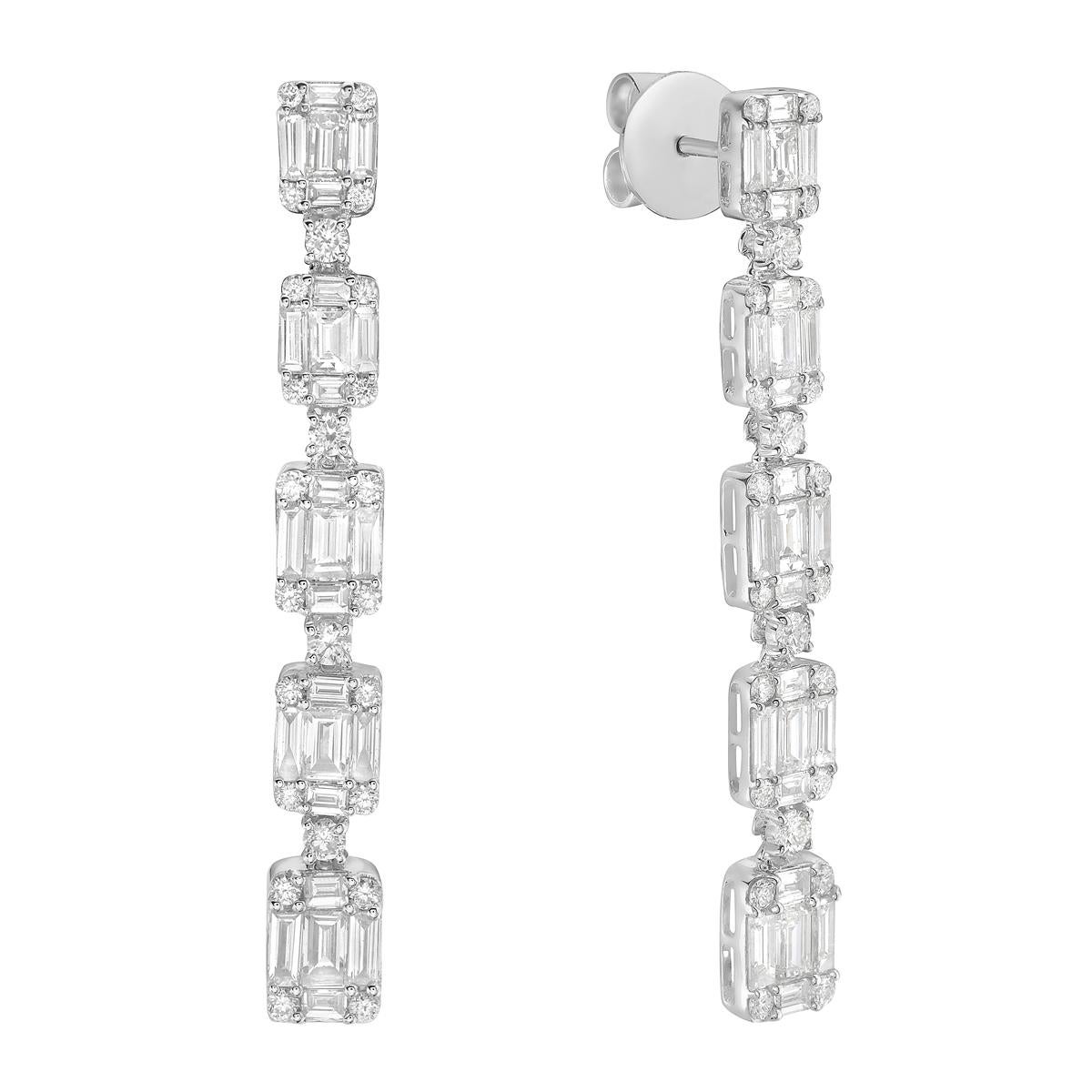 These 18K White Gold Diamond Drop Earrings are the perfect mix of elegance and sparkle. Made from 18K white gold, they have a total weight of 6.7 grams, making them lightweight and comfortable to wear. The earrings feature 2.90 carats of dazzling