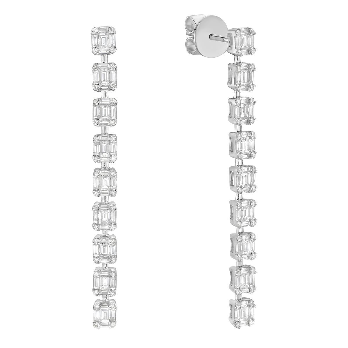 These 18K White Gold Diamond Drop Earrings are a beautiful mix of elegance and sparkle. Made from 18K white gold, they have a total weight of 6.3 grams, making them light and comfortable to wear. The earrings feature 72 round diamonds totaling 0.29