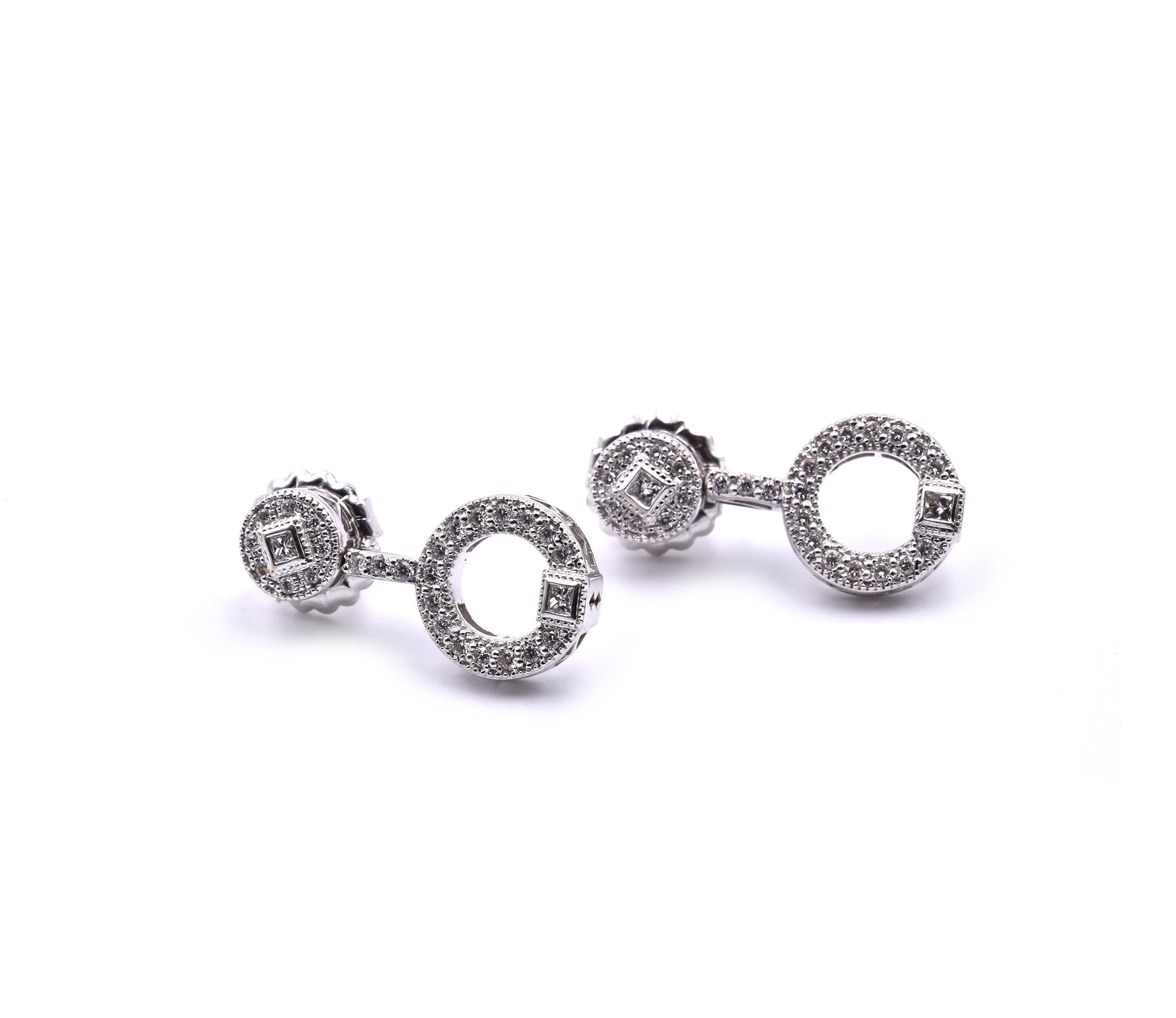 Designer: custom design
Material: 18k white gold
Diamonds: 56 round brilliant cut = 1.12cttw
Color: G
Clarity: VS
Dimensions: earrings are approximately 23.60mm in length and 11.64mm wide
Fastenings: post with friction backs
Weight: 6.54 grams
