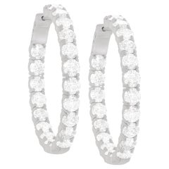 Boucles d'oreilles en or blanc 18K avec diamants