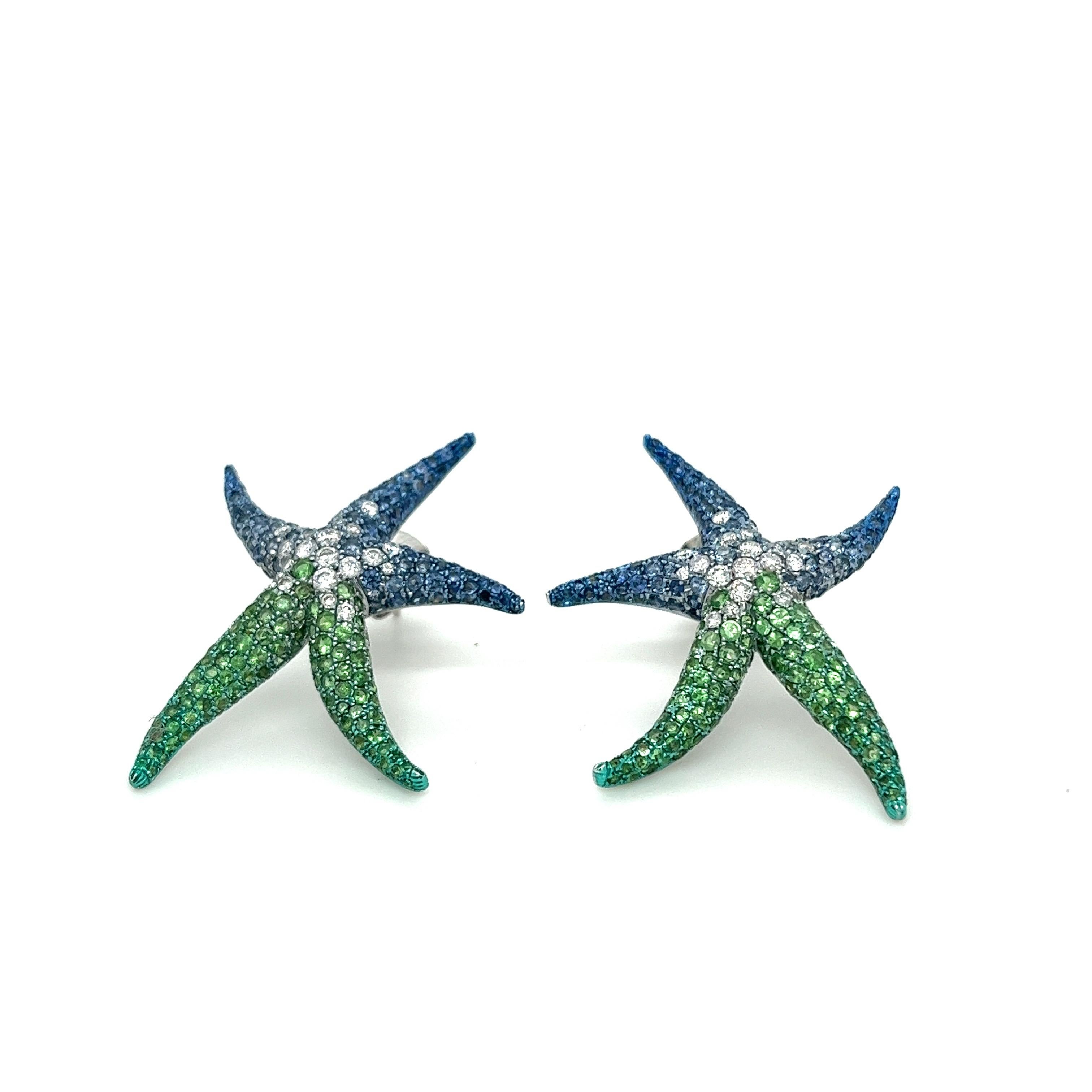 18K White Gold Diamond Earrings with Green Garnets & Sapphires

40 Diamonds - 0.72 CT
282 Green Garnets  - 3.09 CT
286 Blue Sapphires - 2.73 CT
18K White Gold - 10.67 GM

Indulge in the enchanting allure of our handcrafted starfish earrings, adorned