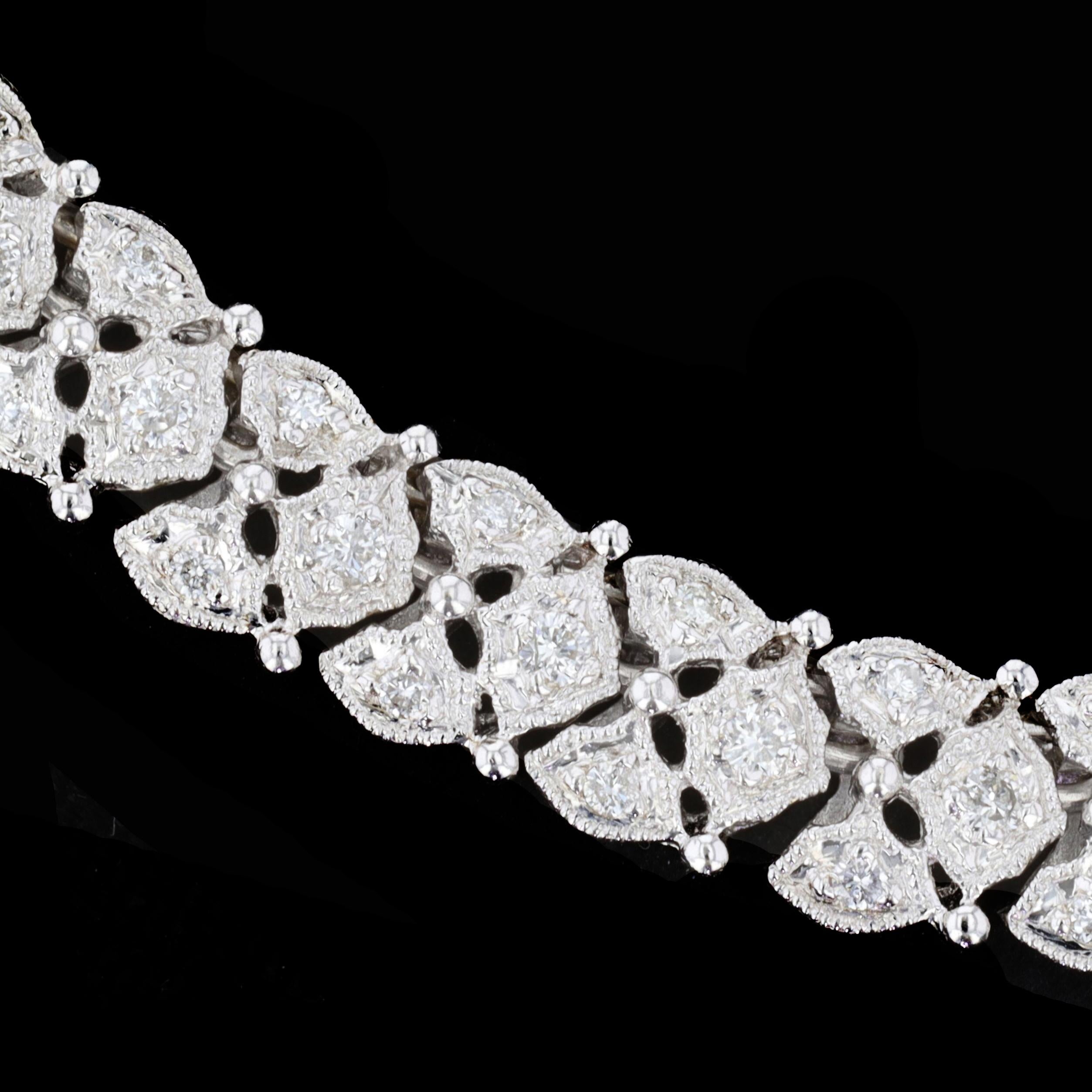 Drape yourself in dazzling elegance. This exceptional 18K white gold estate diamond necklace is set with round cut diamonds that weigh approximately 3.37ct. 

The color of the diamonds is H with VS clarity. The necklace measures 7mm in width and 16