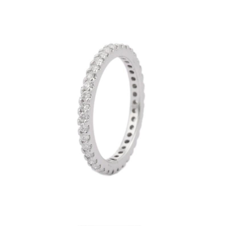 Thin Diamond Eternity Band Ring in 18K Gold symbolizes the everlasting love between a couple. It shows the infinite love you have for your partner. The circular shape represents love which will continue and makes your promises stay forever.
Diamond