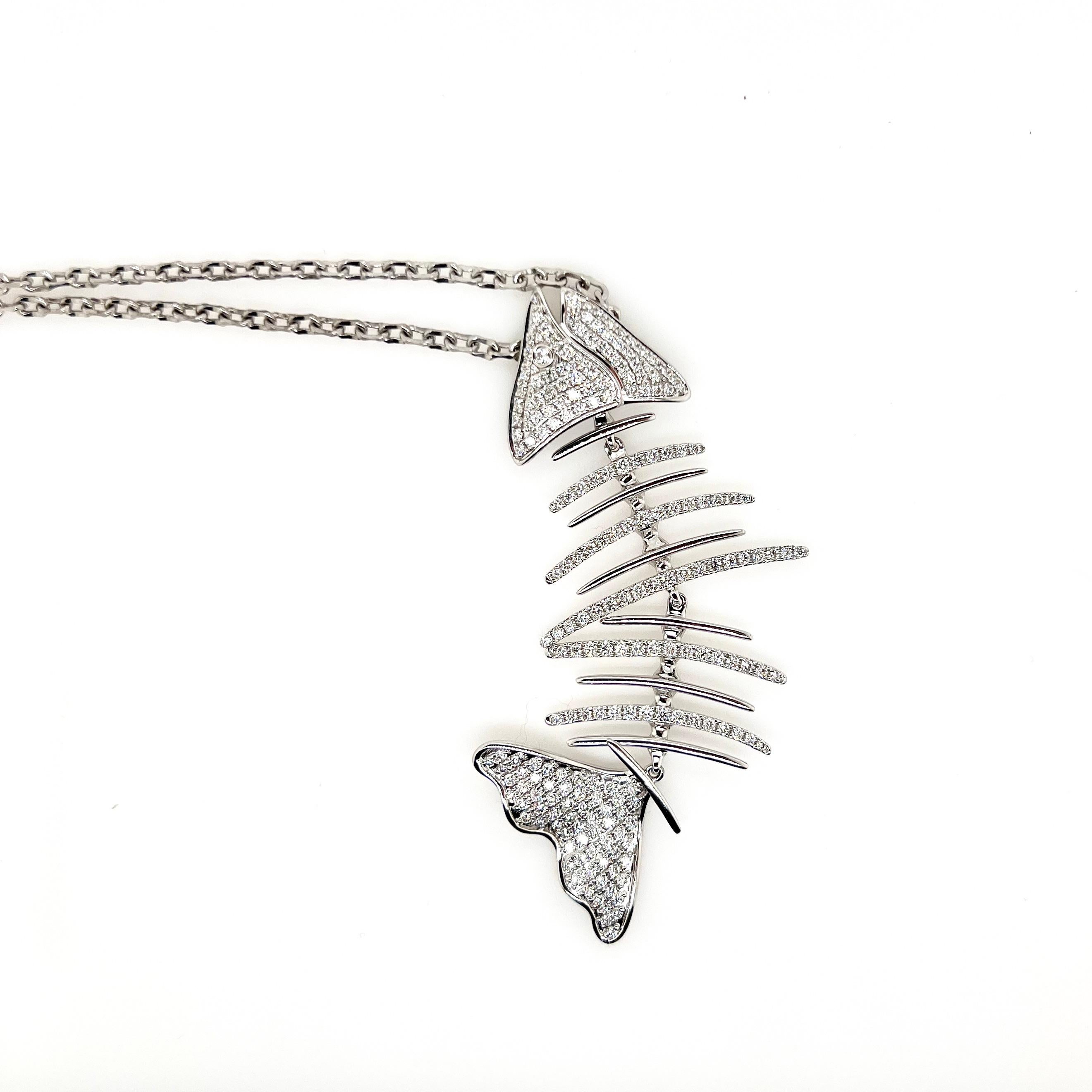 Be bold, be different, and be you!   This amazing fishbone pendant will be the talk to the town!  Its handmade in 18k white gold with round diamonds strategically placed to emphasize the skeletal bone of a fish!   The actual body does wiggle and has