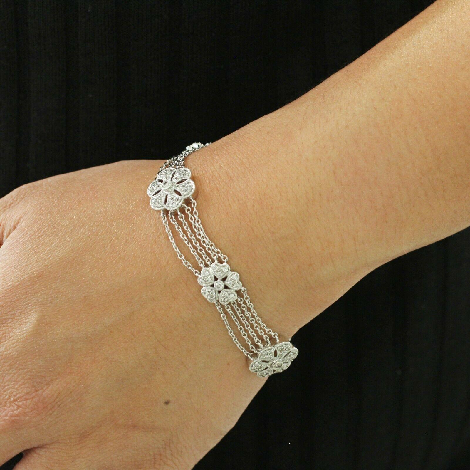  Beautiful diamond flower station bracelet features a very unique style flowers with diamonds that float in very thin cable dainty chain in 18k white gold metal 7.5 inches. This bracelet has round cut diamonds and has an approximately 1.60 carat