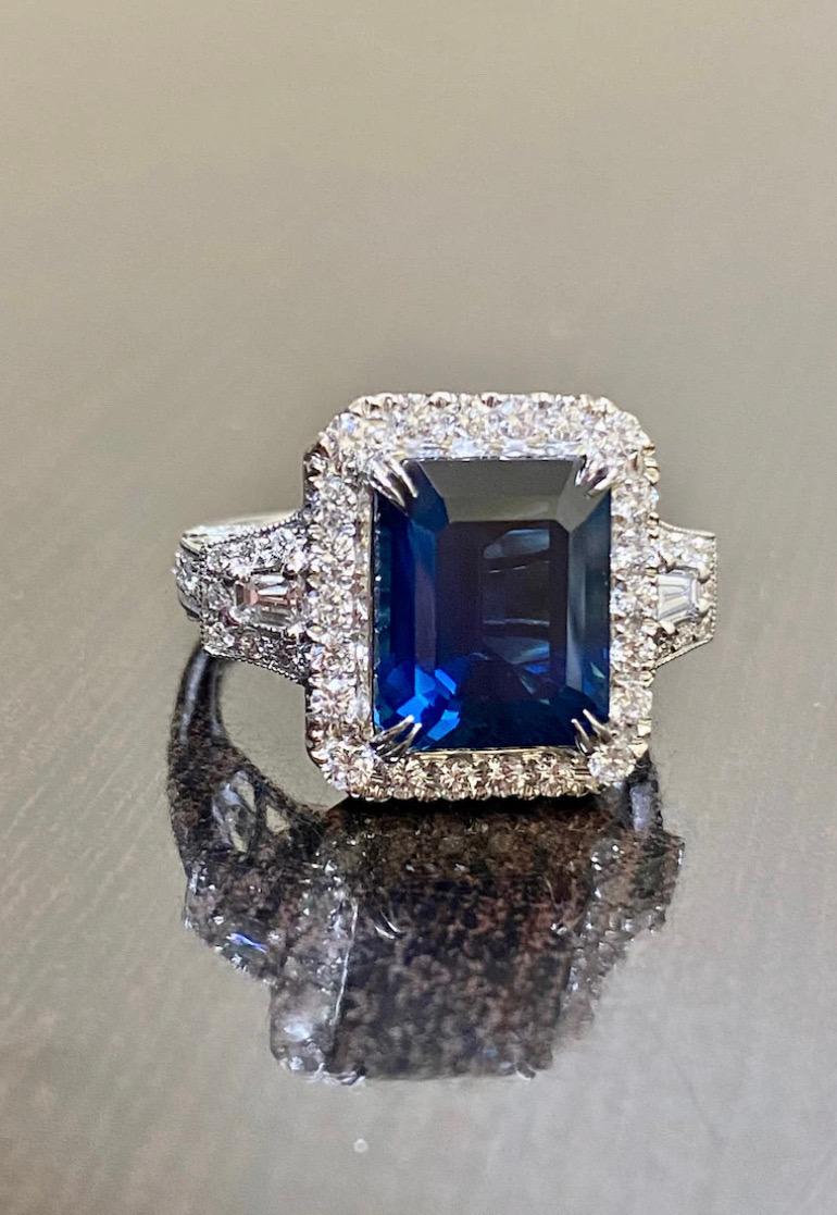 DeKara Designs Collection

Beautiful Modern/Art Deco Emerald Cut Blue Sapphire and Diamond Ring.

Metal- 18K White Gold, 750.

Stones- Genuine Emerald Cut Blue Sapphire 7.50 Carats, 50 Round Diamonds, 2 Tapered Baguette Diamonds, G-H Color VS1-VS2