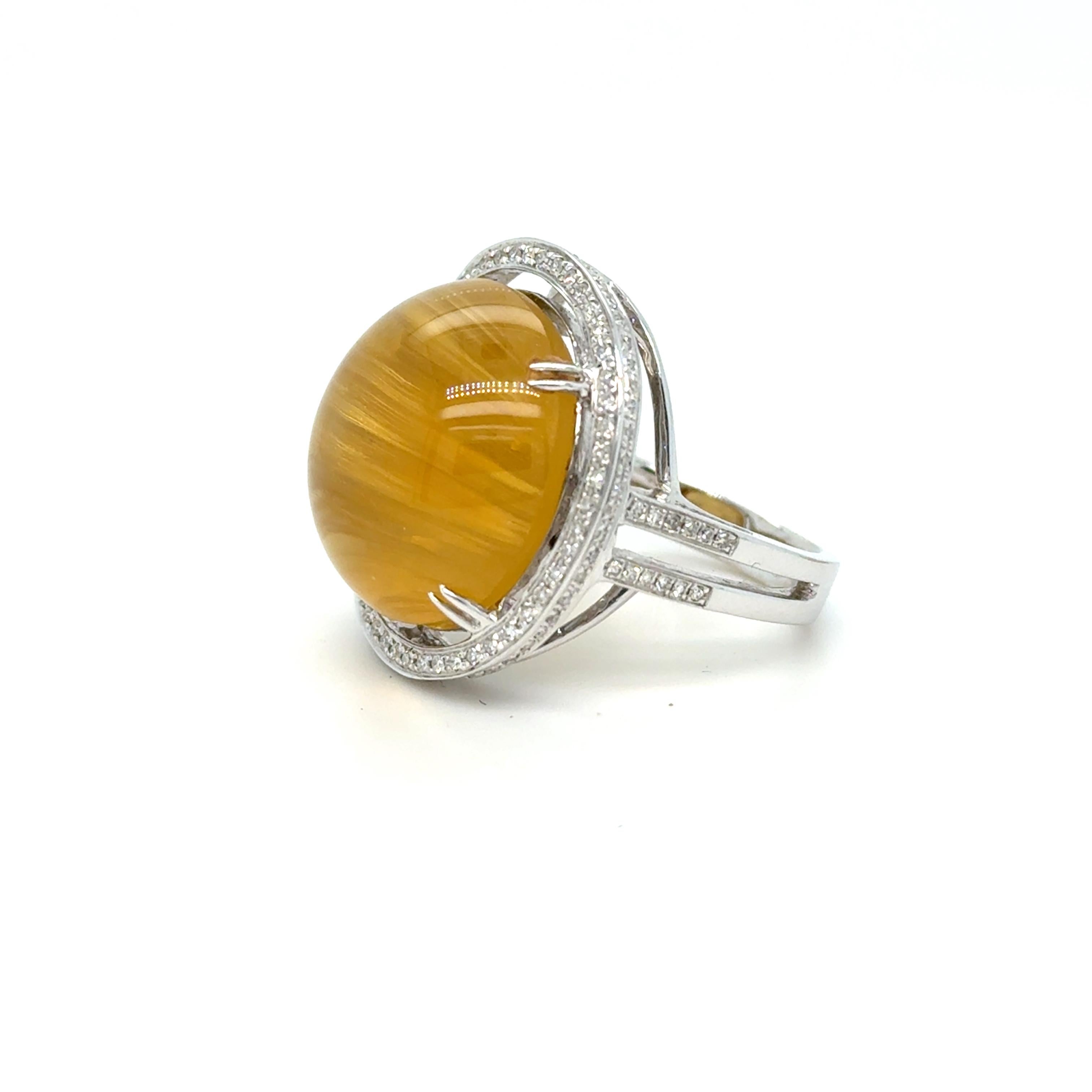 Modern 18K White Gold Diamond Halo and Cat's Eye Chrysoberyl Ring For Sale