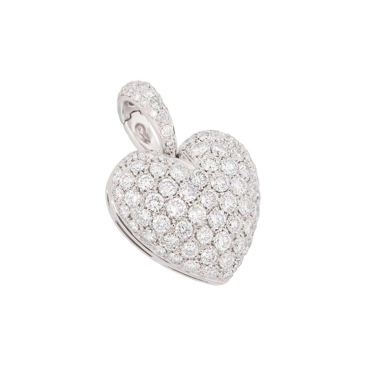 An 18k white gold diamond heart pendant. The heart shaped pendant is pave set with round brilliant cut diamonds which are also on the loop bail. There approximately 95 round brilliant cut diamonds which have an approximate weight of 1.97ct. The