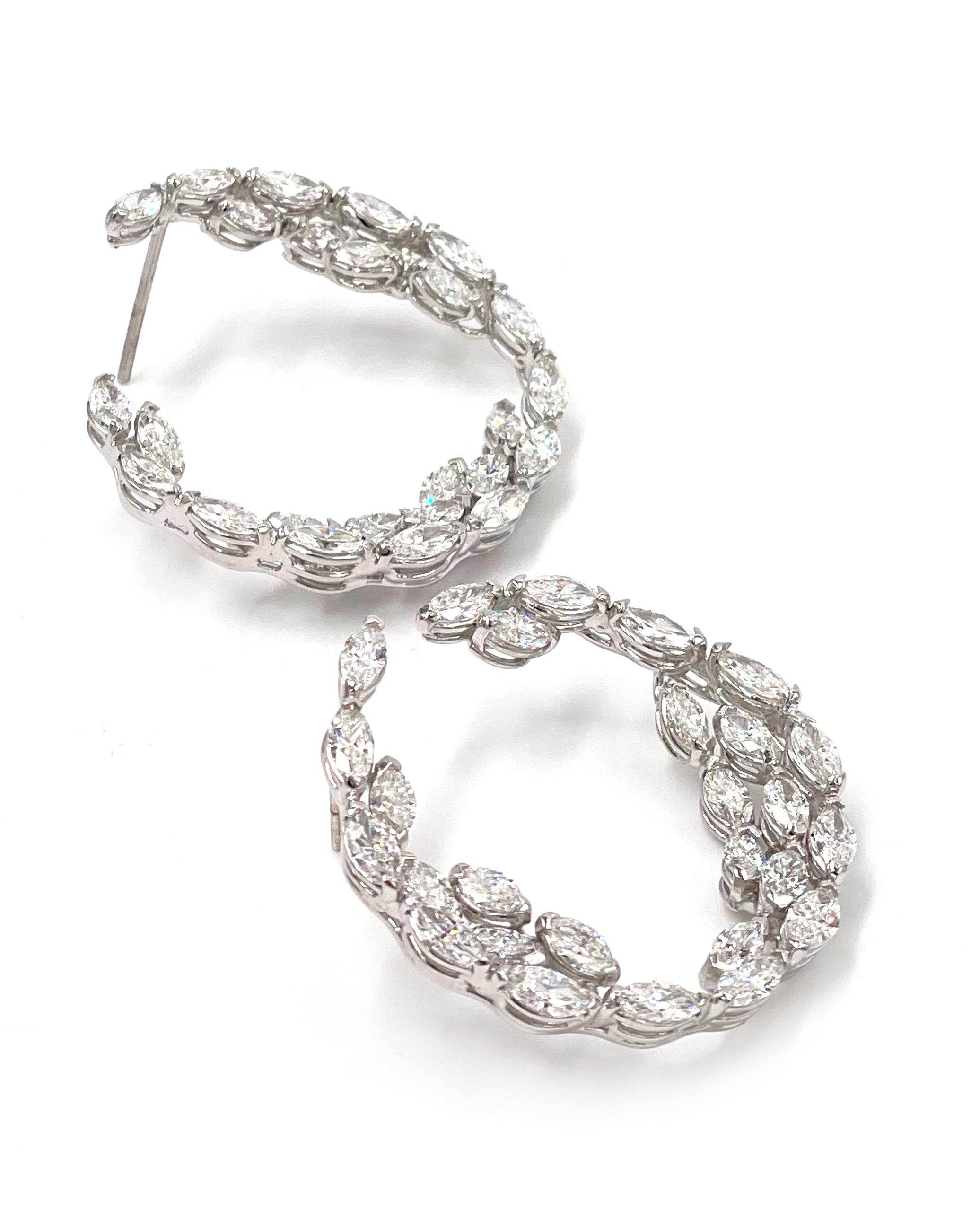 Pictures don't do justice.  Show stopping 18k white gold hoop earrings furnished with 54 marquise shaped diamonds totaling 7.68 carats (F/G color, VS clarity).

* Push backs included.