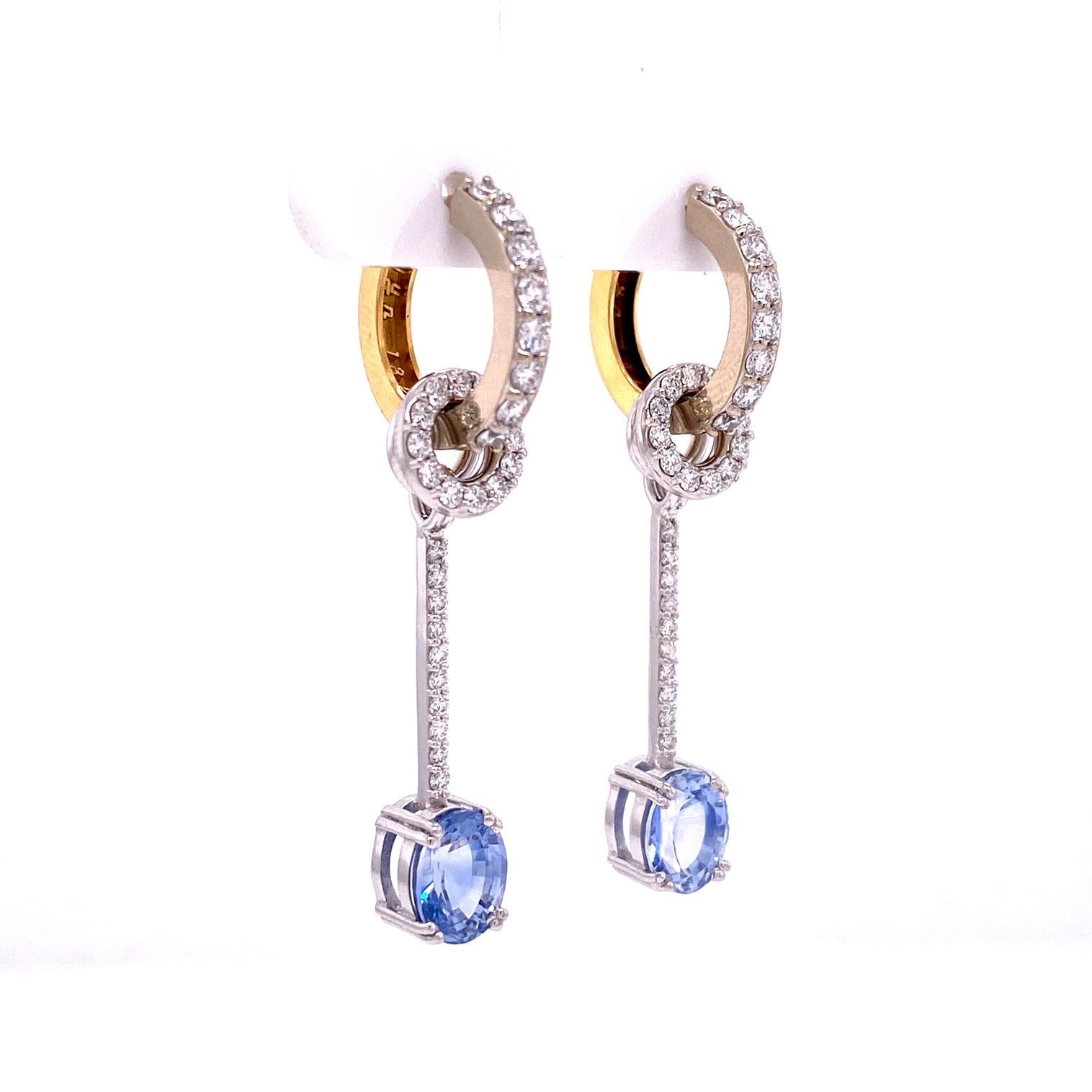 A pair of 18k white and 18k yellow and white gold reversible 