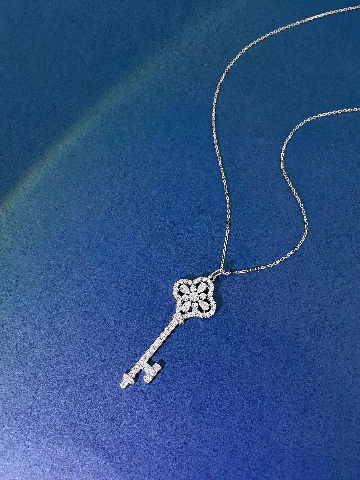 18K White Gold Diamond Key Necklace
Diamonds - 0.95 CT 
18K White Gold - 4.99 GM

Nurati Jewelry's enchanting key pendant is a timeless piece that exudes elegance and grace. Crafted in luxurious white gold, this stunning pendant is adorned with