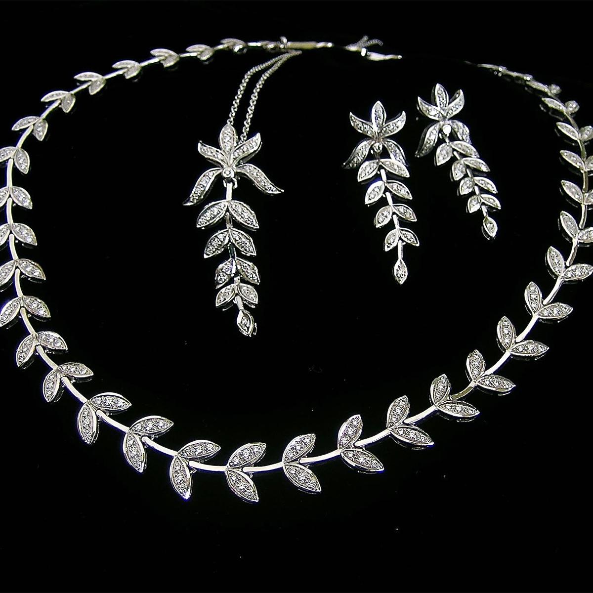 Modern 18 Karat White Gold and Diamond Leaf Earrings For Sale
