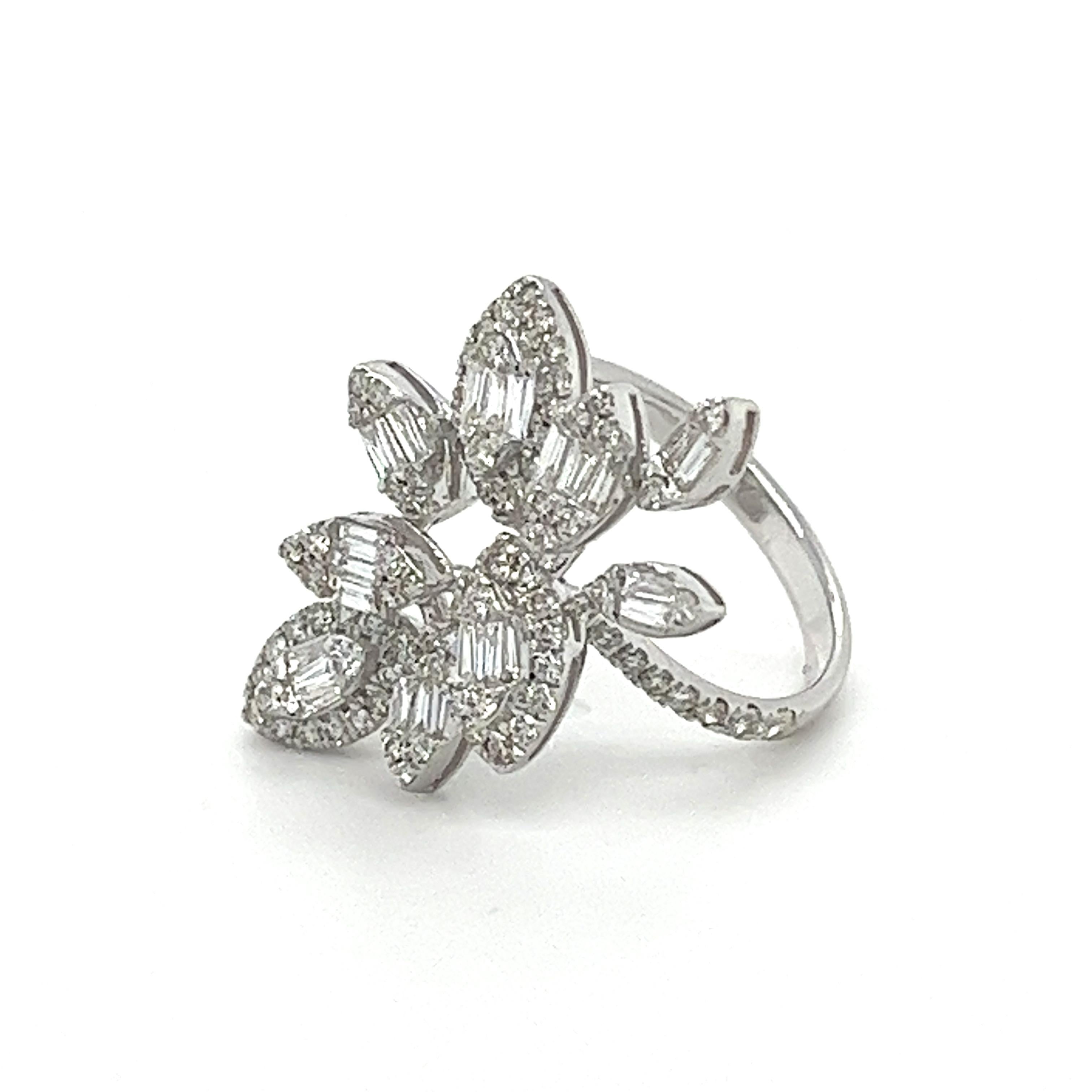 18K White Gold Diamond Leaf Ring

 91 Diamonds - 0.845 CT
 25 Diamonds - 0.435 CT
 18K White Gold - 5.126 GM

Crafted with impeccable artistry, this delicate 18K white gold ring showcases a captivating leaf-like design. Clusters of sparkling