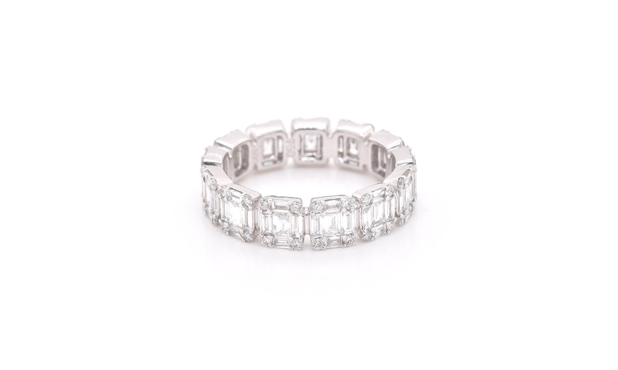 Designer: custom design
Material: 18k white gold
Diamonds: 52 round brilliant cut = .43cttw
Color: G
Clarity: VS
Diamonds: 65 baguette cut = 1.60cttw
Color: G
Clarity: VS
Ring size: 6.25 
Dimensions: ring is 7.51mm
Weight: 8.24 grams 
