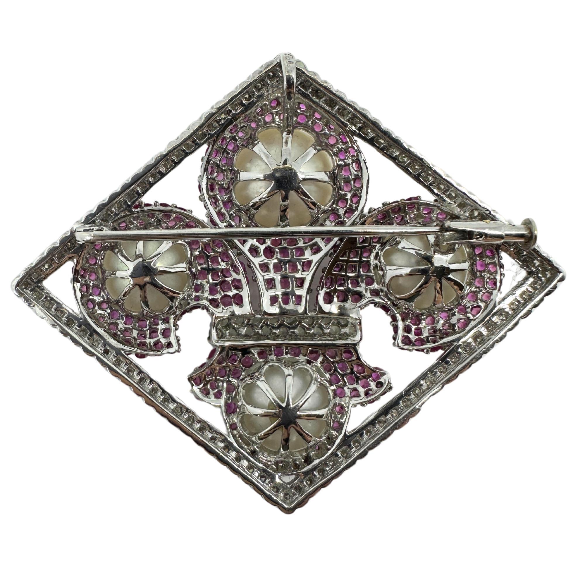 18K White Gold Diamond, Multicolor Sapphire and Pearl Brooch and Pendant
Condition: In good condition with some minor surface wear consistent with age.
Length: 1.90 inches 
Width: 2.25 inches
Markings: 