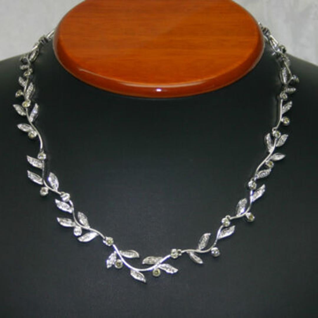 Weighing In At 44.50 Grams.
It contains 196 Round Brilliant Diamonds.
Including fancy yellows,  1.25mm to 2.25 mm.
6.50 total carats mounted in pave and bezel settings all over it.
It measures 17 Inches long.
It Is In Excellent Condition.
