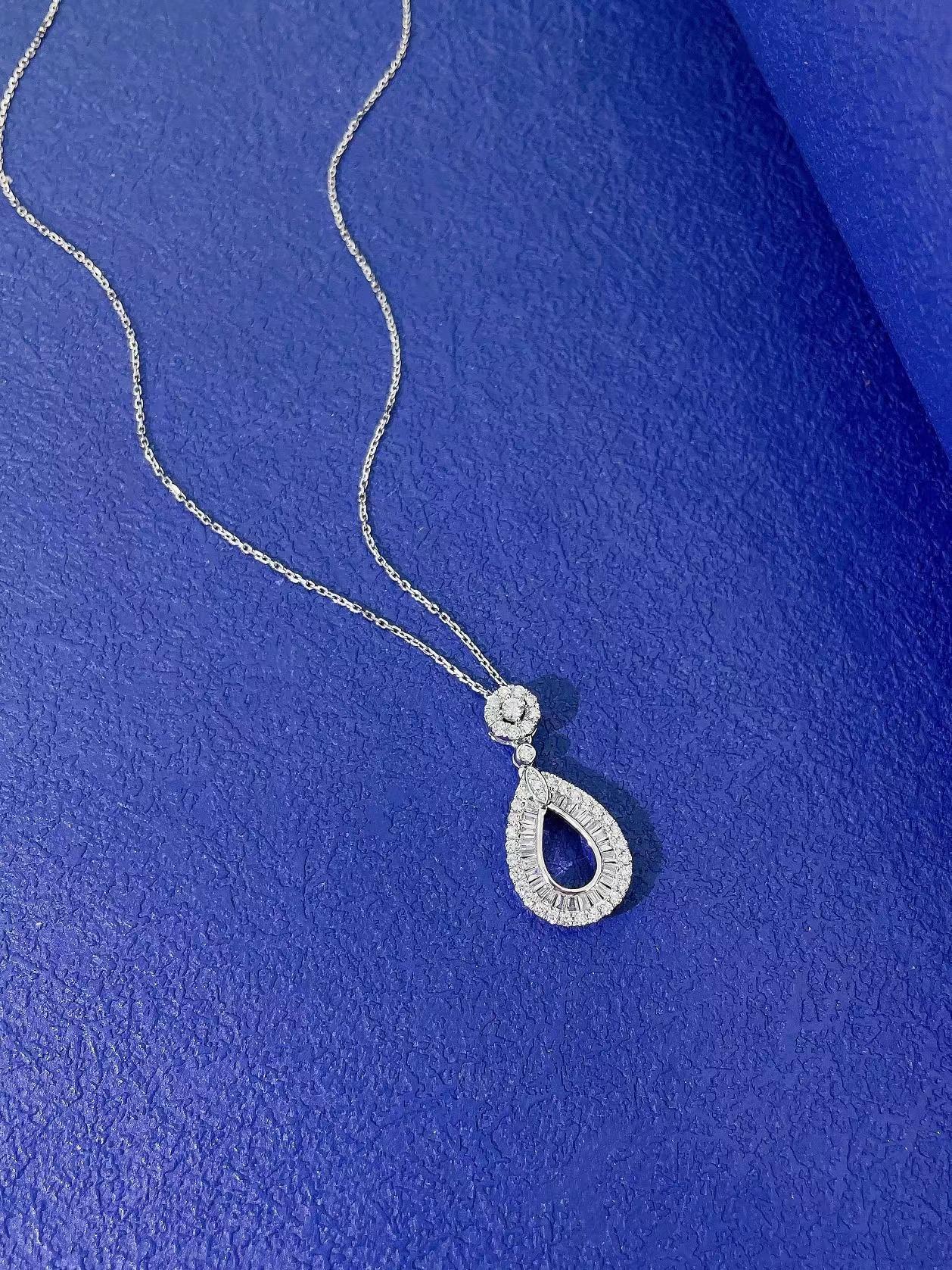 18K White Gold Diamond Necklace
Diamonds - 0.43 CT 
18K White Gold - 2.26 GM

Nurati Jewelry's elegant teardrop pendant is a perfect blend of sophistication and style. Available in both white and rose gold, this stunning piece features a dazzling