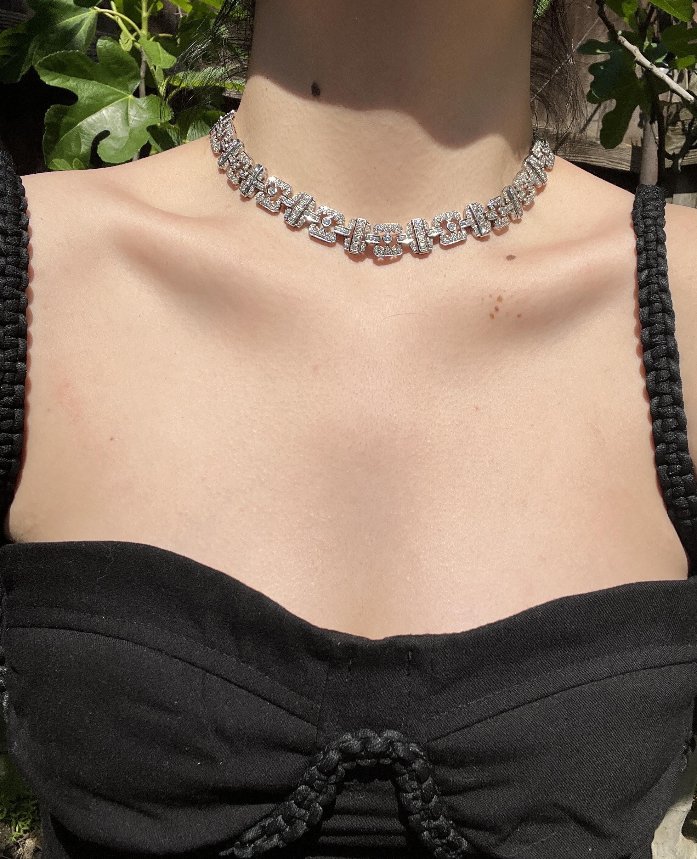18K White Gold Diamond Necklace

Marked: 
750. 

Approximate Dimensions: 
40.5 cm (Length) 
1.4 cm (Width) 
Approx. 9.69 carats (Diamond) 
56.1 grams in weight.