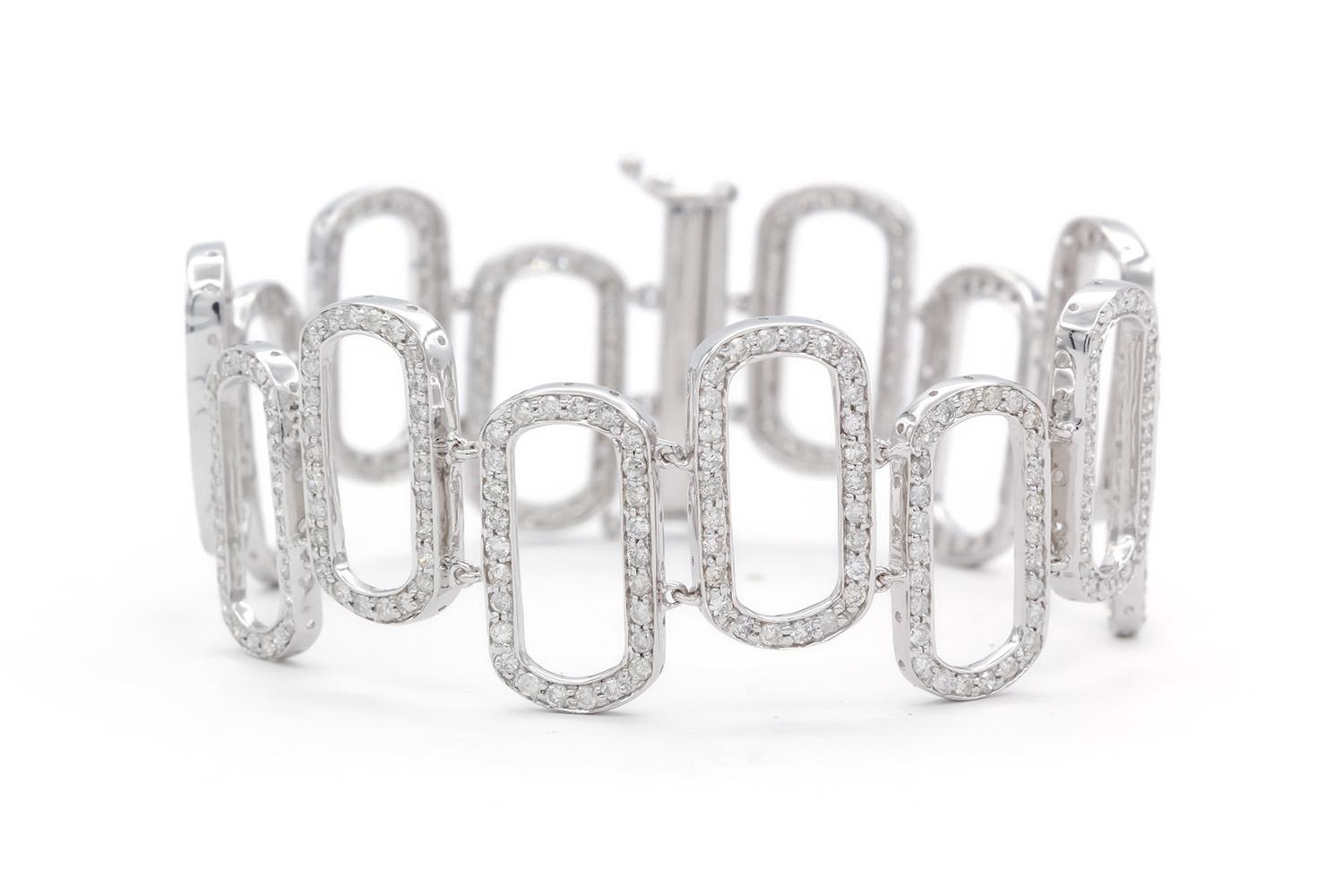 We are pleased to present this beautiful 18k White Gold & Diamond Oval Link Bracelet. It features an estimated 4.20ctw G-H/VS2-SI1 Round Brilliant Cut Diamonds set in this 18k white gold oval link bracelet. The bracelet measures 6.75″ long and