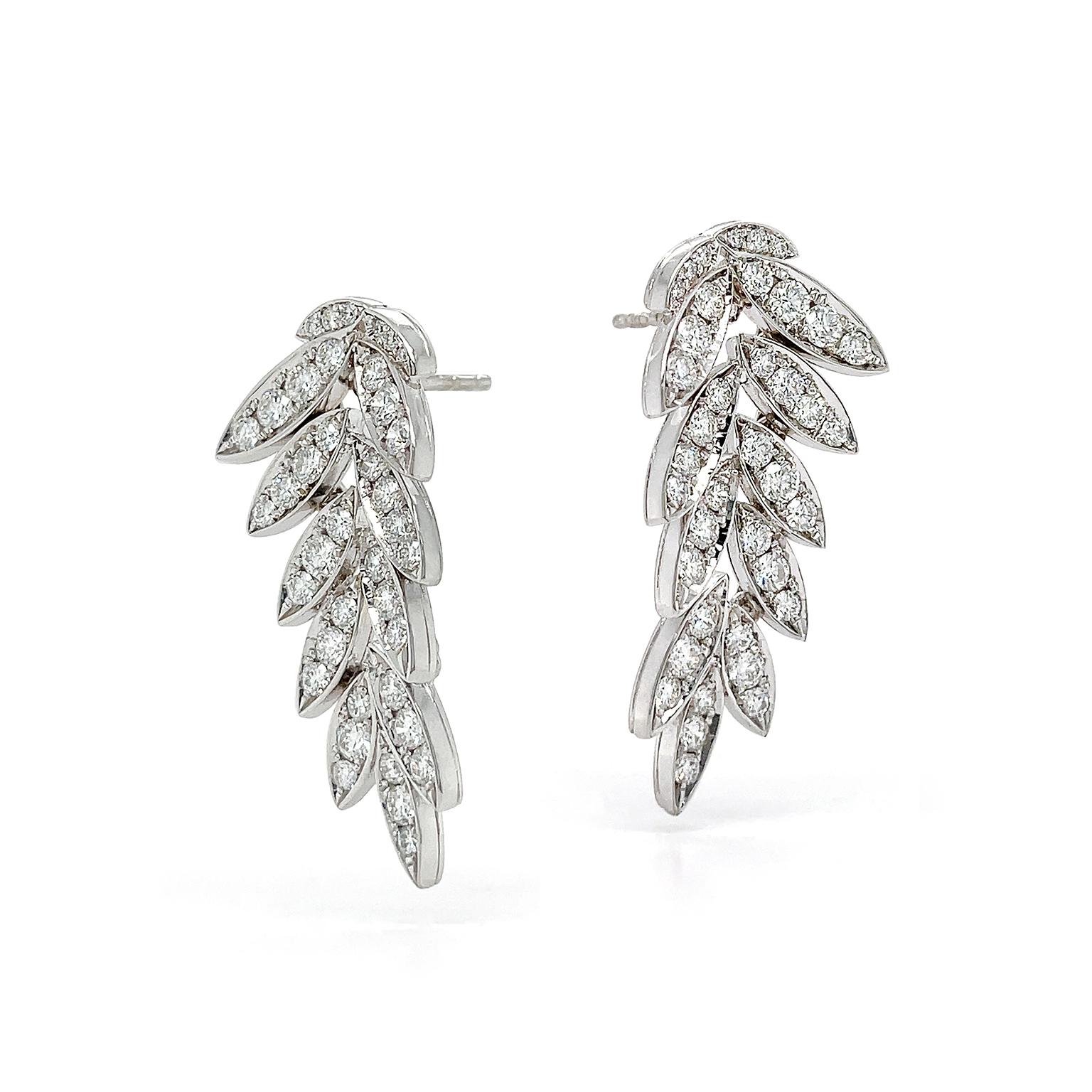 These earrings turn diamonds into greenery. Dozens of jewels are faceted into round brilliant-cut diamonds for optimal brightness. They’re pavé set into groups of three or four on 18kt white gold. Together, they create scintillating leaves. The
