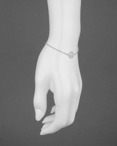 ​18 Karat White Gold and Diamond Peace Sign Bracelet