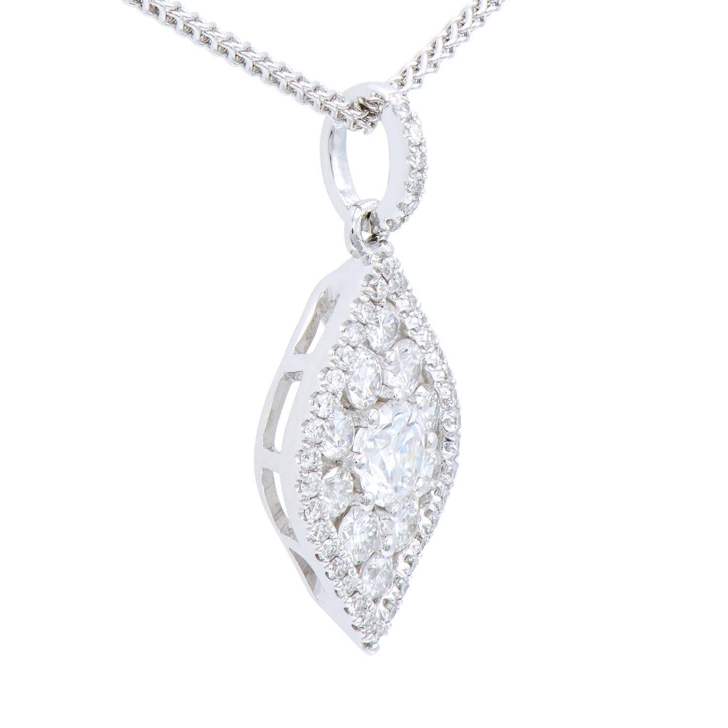 This beautiful pendant is made of 51 round VS2, G color diamonds totaling 0.58 carats to create unique design. The diamonds are set in 1.4 grams of 18 karat white gold. Included is an 18 inch, 18 karat white gold chain.