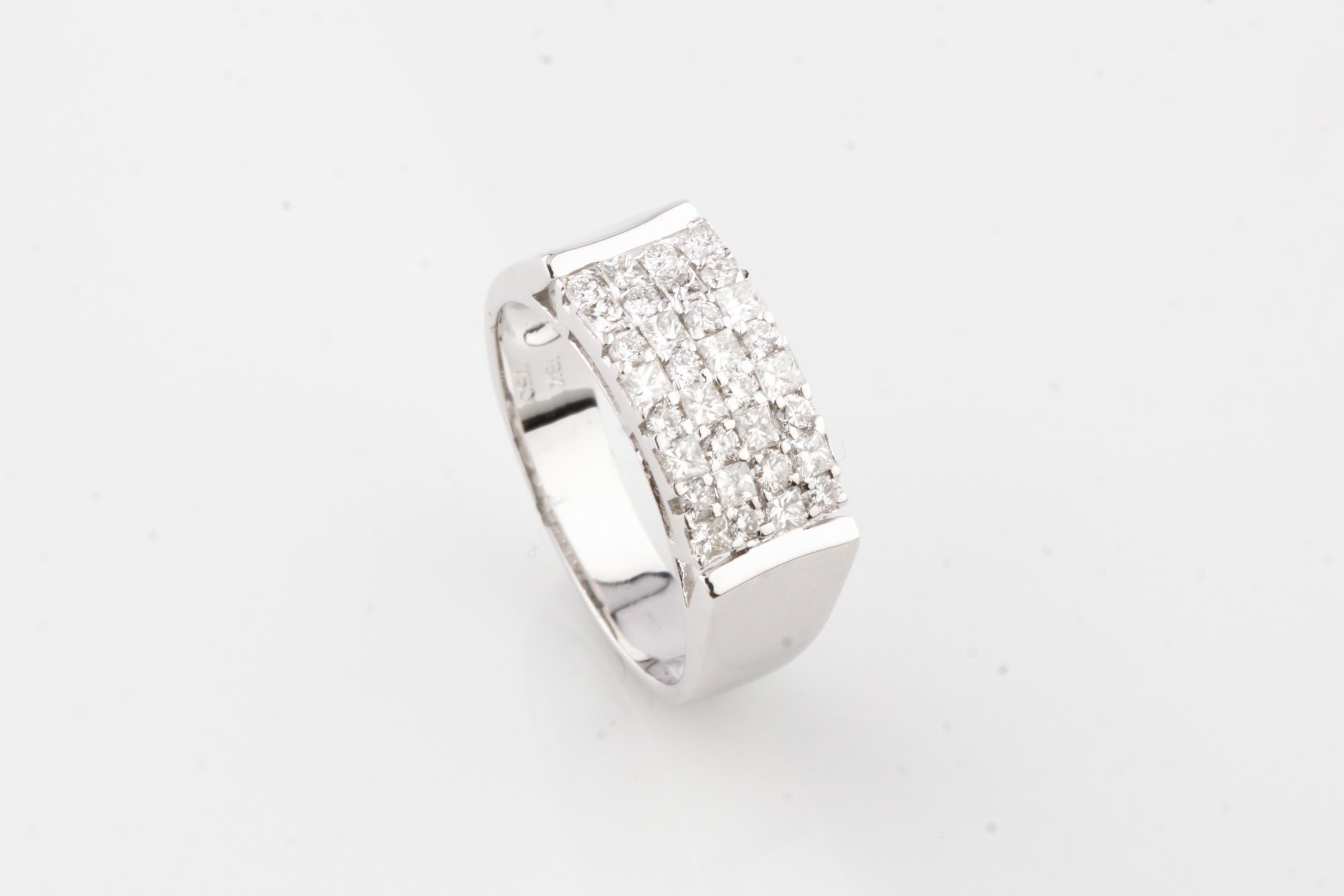 Gorgeous Plaque Ring
Features Prong-Set Rows of Princess Cut Stones
Dimensions of Plaque = 14 mm x 7 mm
Total Diamond Weight = 0.76 ct
Average Color = H
Average Clarity = SI
Total Mass = 5.3 grams
Size 6.5
Gorgeous Gift!
