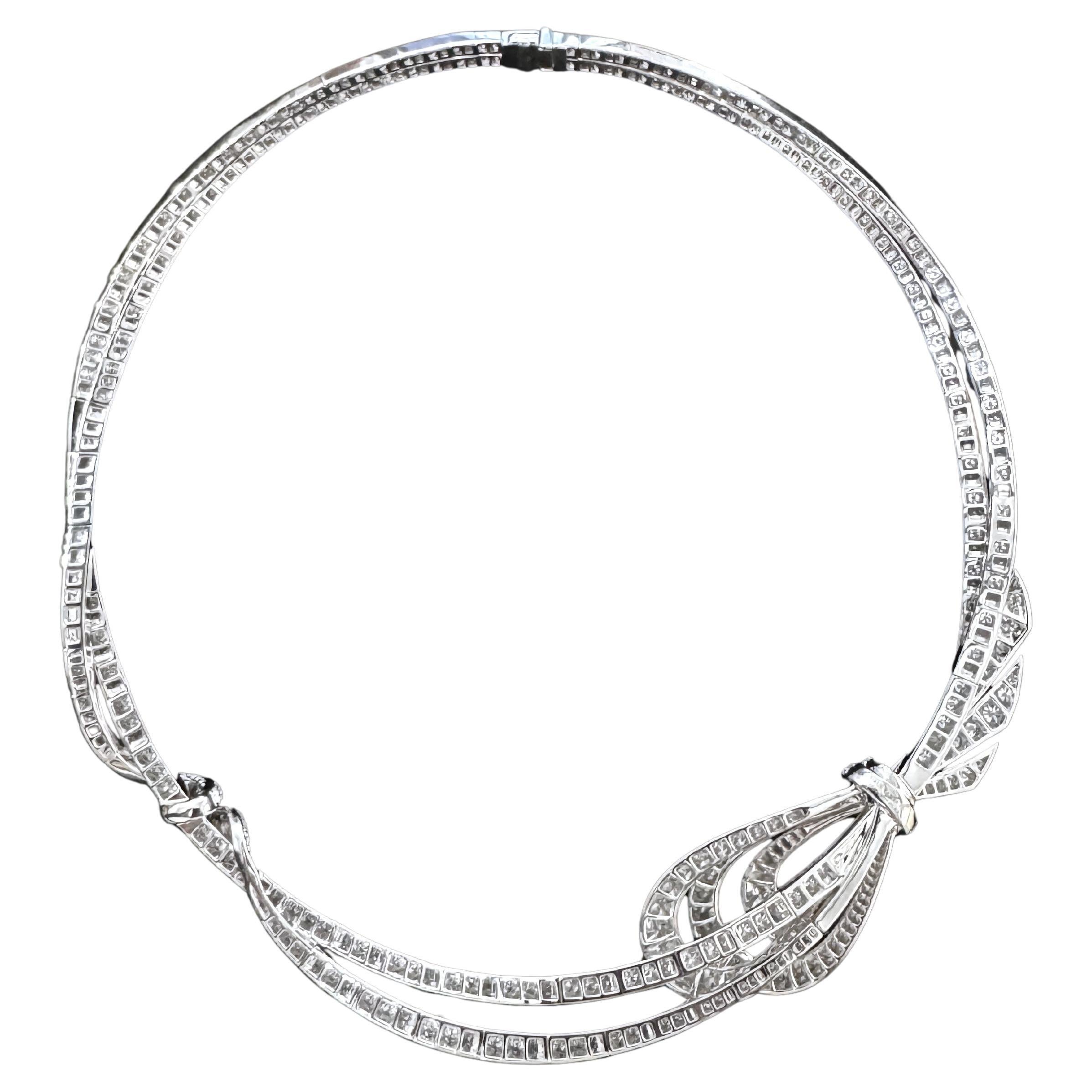 Elevate your elegance with this exquisite 18K white gold diamond necklace, masterfully crafted for timeless sophistication. Designed with a graceful ribbon bow centerpiece, the necklace is adorned with shimmering round brilliant-cut diamonds that