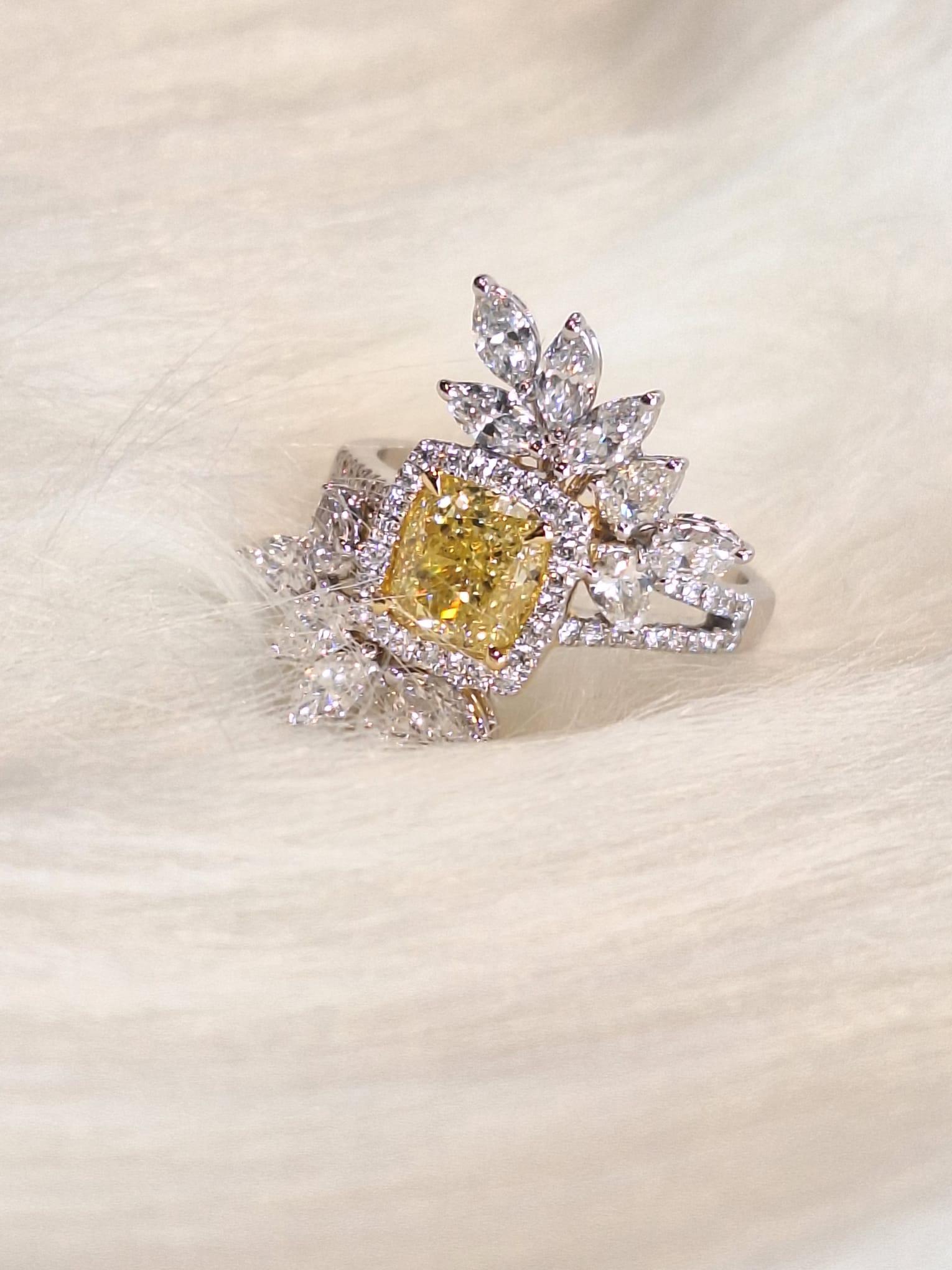 18K White Gold Diamond Ring with Fancy Yellow

Yellow diamonds represent love, happiness and optimism, while mean the beginning or the continuation of a long and happy relationship.

Diamonds symbolise clarity and purity, also represent innocence,