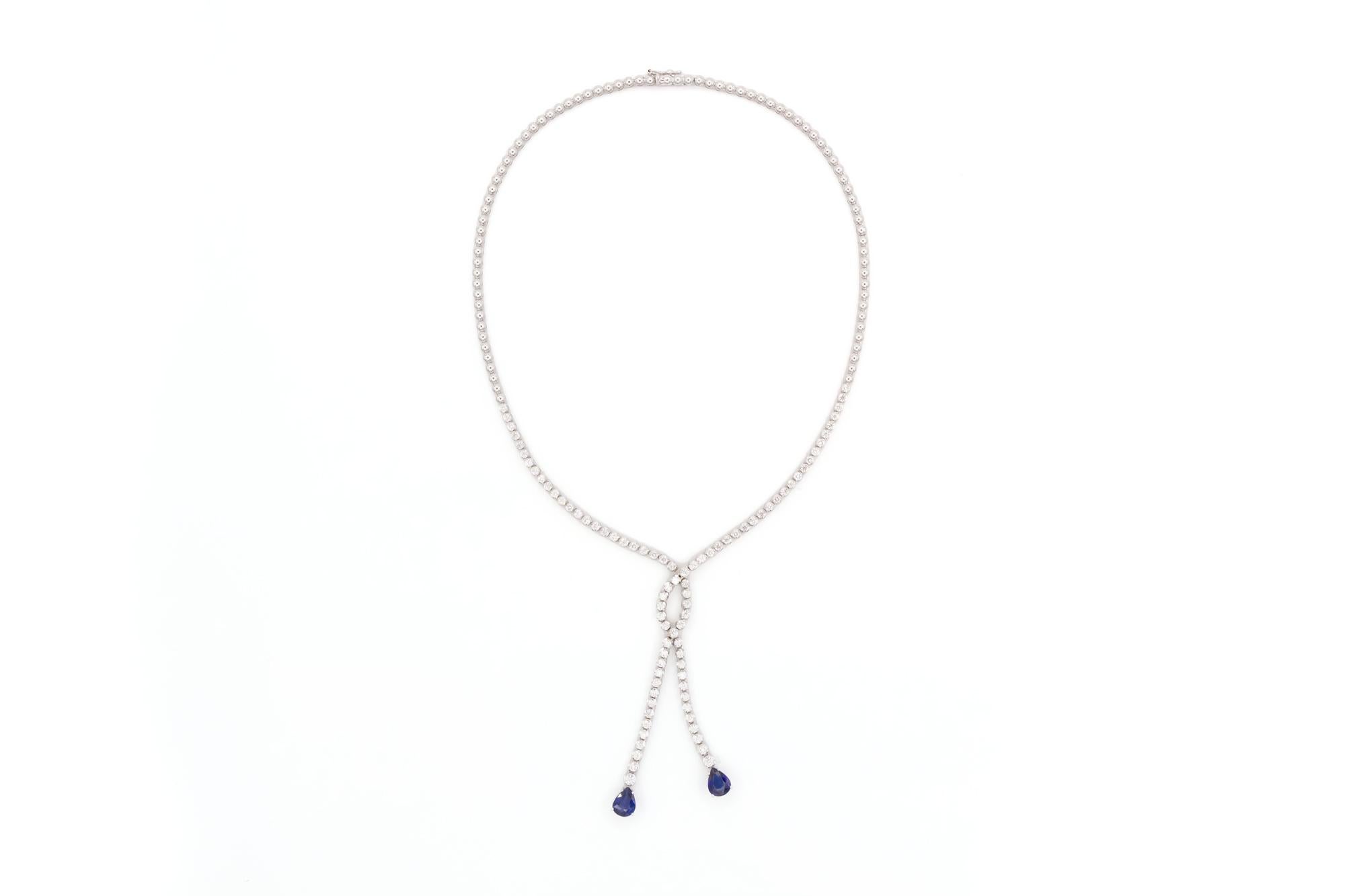 We are pleased to offer this 18k White Gold Diamond & Sapphire Double Drop Necklace. A timeless design crafted from 18k white gold, dazzling round brilliant cut diamonds and pear shape sapphires this stunning necklace features an estimated 3.11ctw