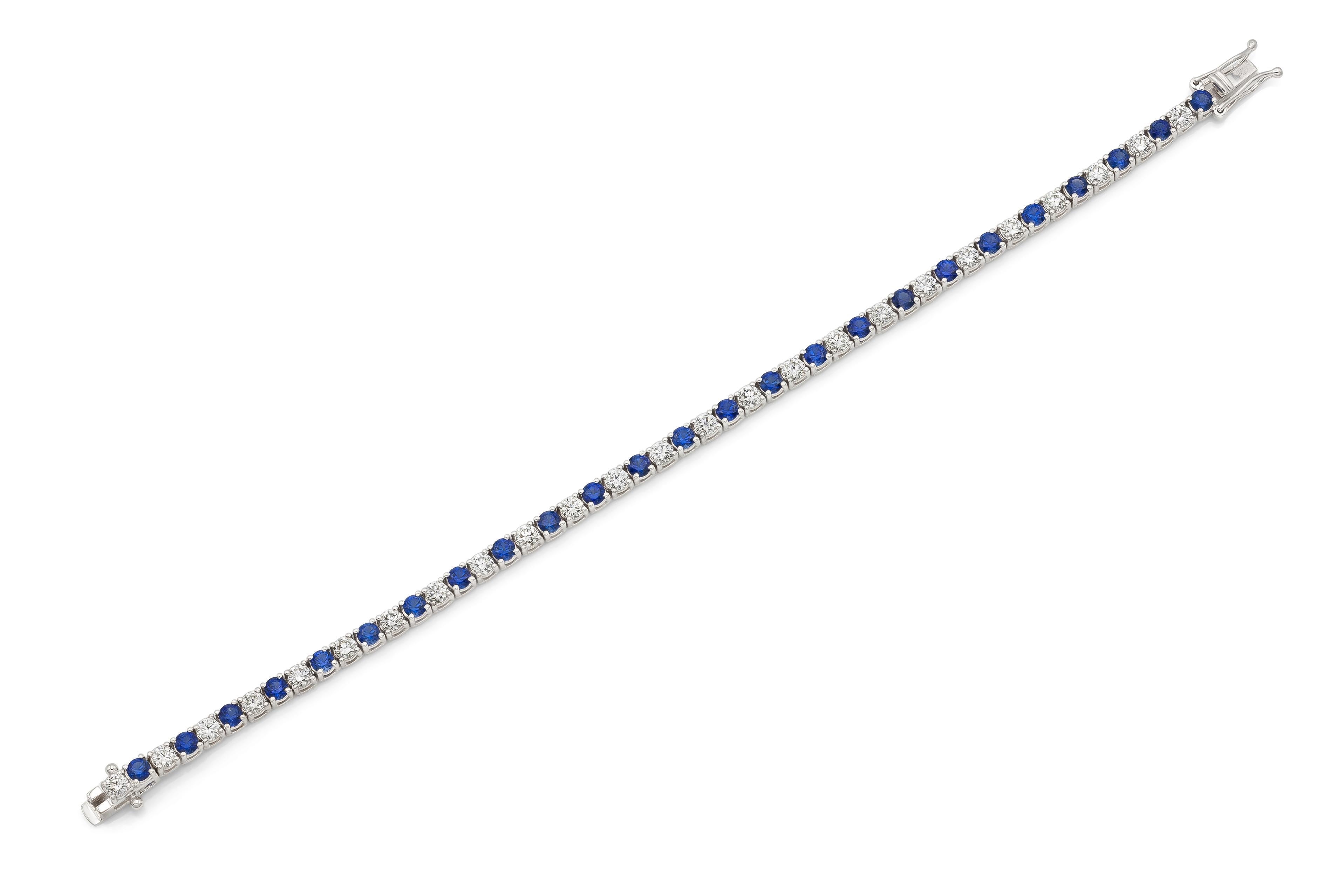 18K White Gold Tennis Bracelet with 25 Round Brilliant Cut Diamonds D color VVS1 clarity weighting 2.16 carats & 25 Natural Blue Sapphires weighting 3.38 carats Total weight 5.54 carats, wrist size 6.5 inch. 

Resizing to smaller or bigger size is
