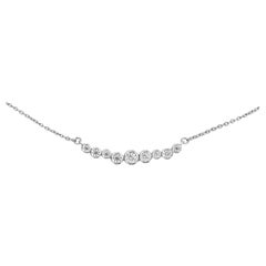 Collana a barre a cascata con diamanti e oro bianco 18 carati