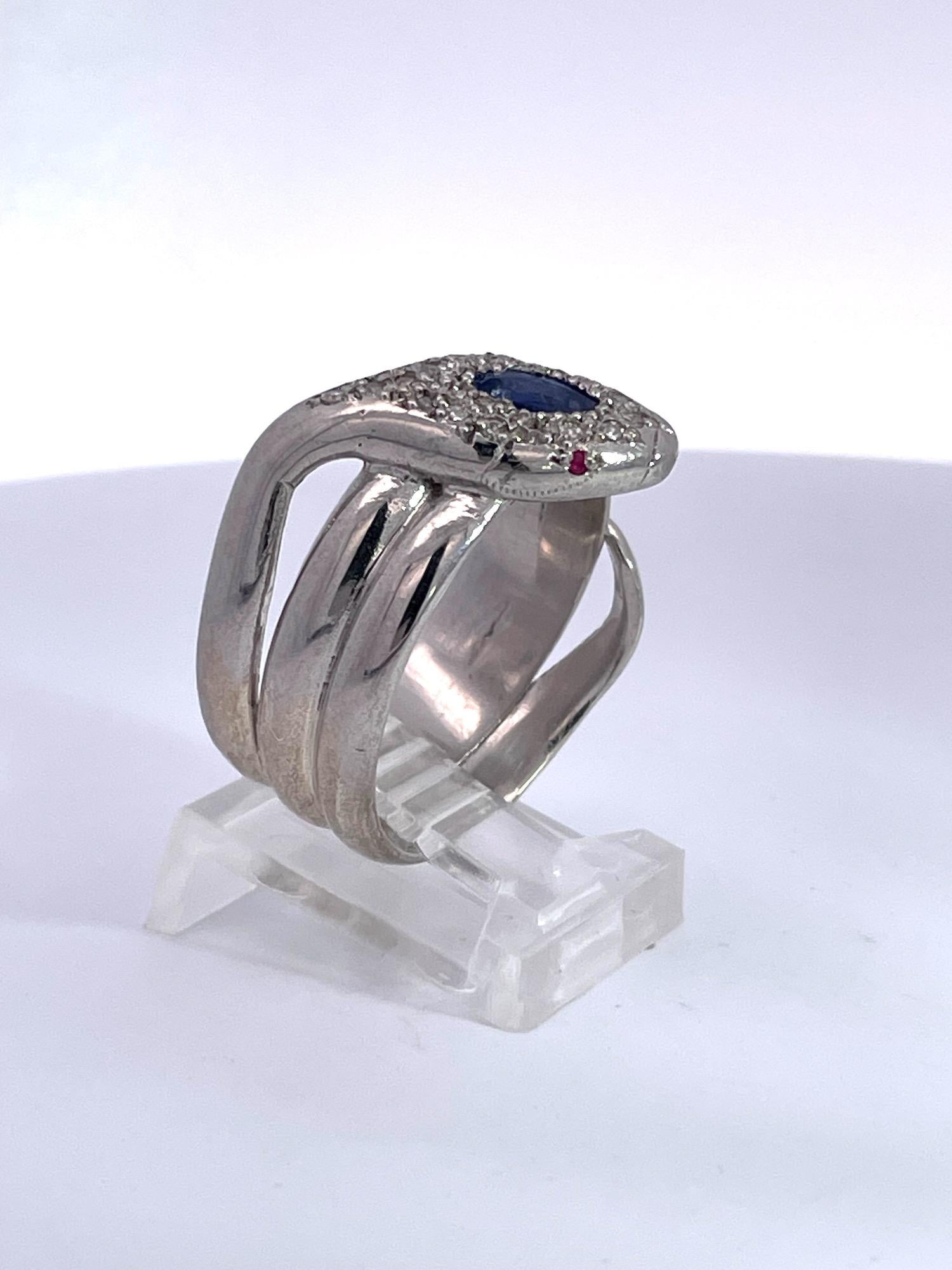 This 18K White Gold Diamond Tanzanite Head Snake Ring was made after 1960 as that is when the mines in Tanzania opened with this new stone.  Tanzanite is ONLY found in Tanzania, Africa so this is a new edition to the collection of snake jewelry. 