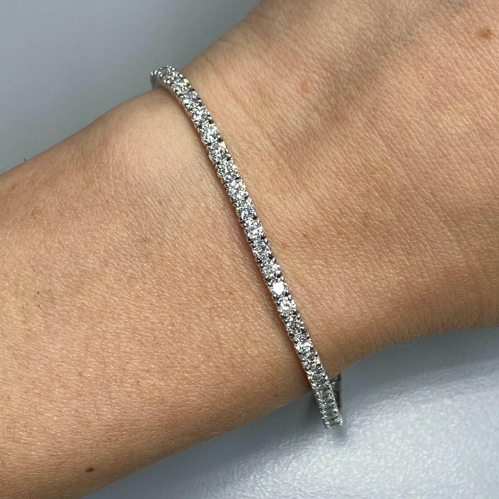 Specifications:
    main stone:ROUND DIAMONDS
    diamonds:64 PCS
    carat total weight:approximately 4.01 CTW
    color:g
    clarity:VS-SI
    brand:CUSTOM MADE
    metal:18K WHITE gold
    type:BRACELET
    weight:8.44 gr
    LENGHT:7 INCH
   