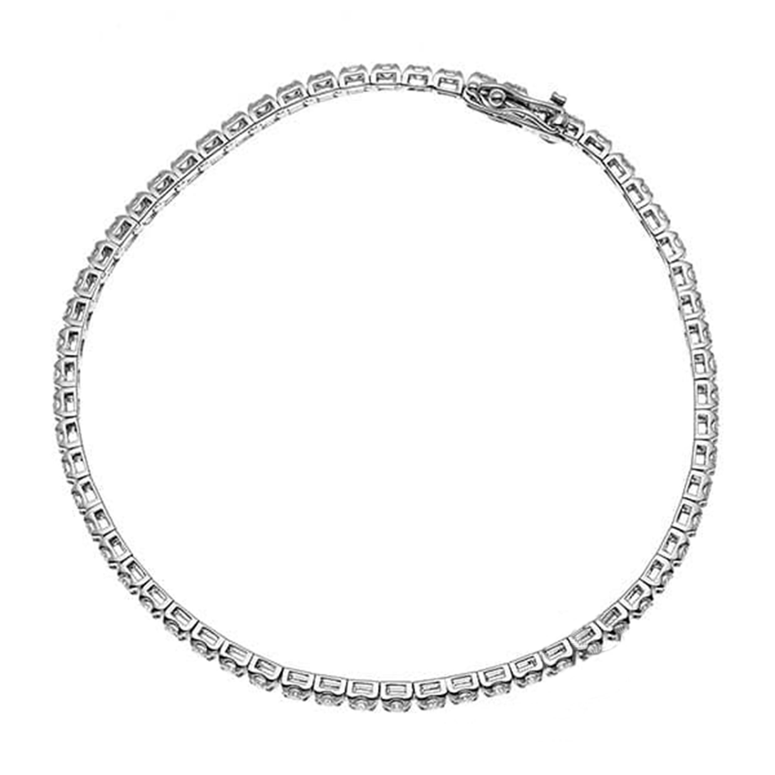 Elevate your wrist with this stunning 18K white gold diamond tennis bracelet. Adorned with 52 dazzling diamonds totaling 5.17 carats, this bracelet is a timeless and luxurious addition to any jewelry collection. Each diamond is meticulously set in a