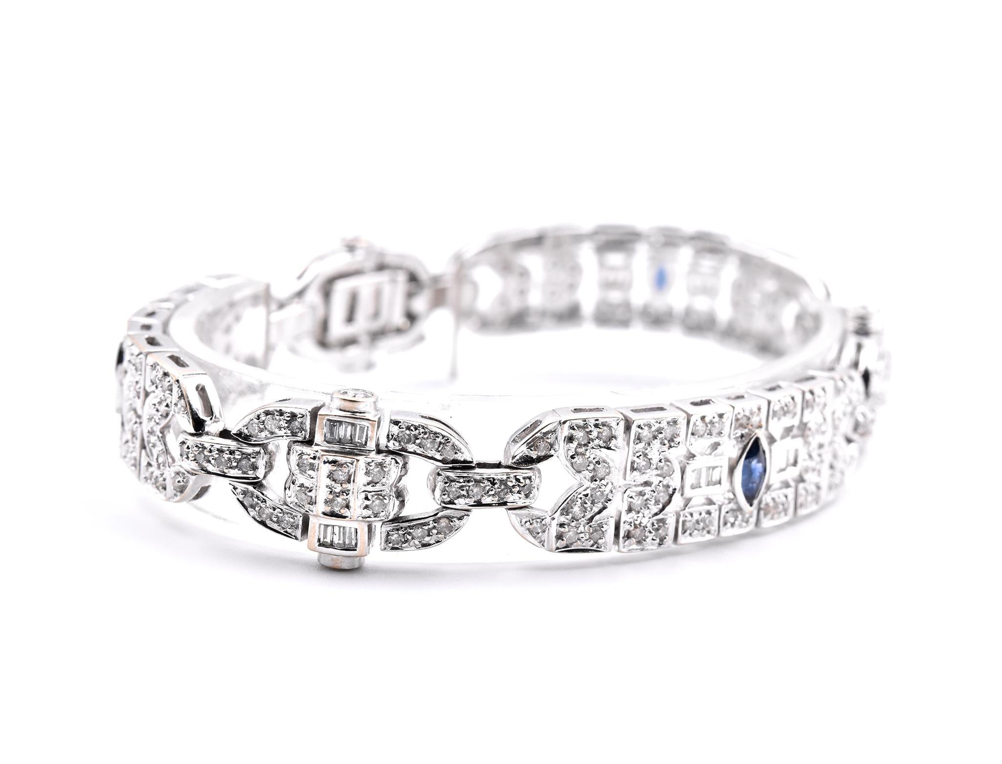 Designer: custom design
Material: 18k white gold
Round Diamonds: 222 round brilliant cuts = 3.40cttw
Color: I-J
Clarity: I1
Baguette Diamonds: 24 baguette cuts = 0.50cttw
Sapphires: 3 marquise cuts = 0.33cttw
Dimensions: bracelet will fit up to an