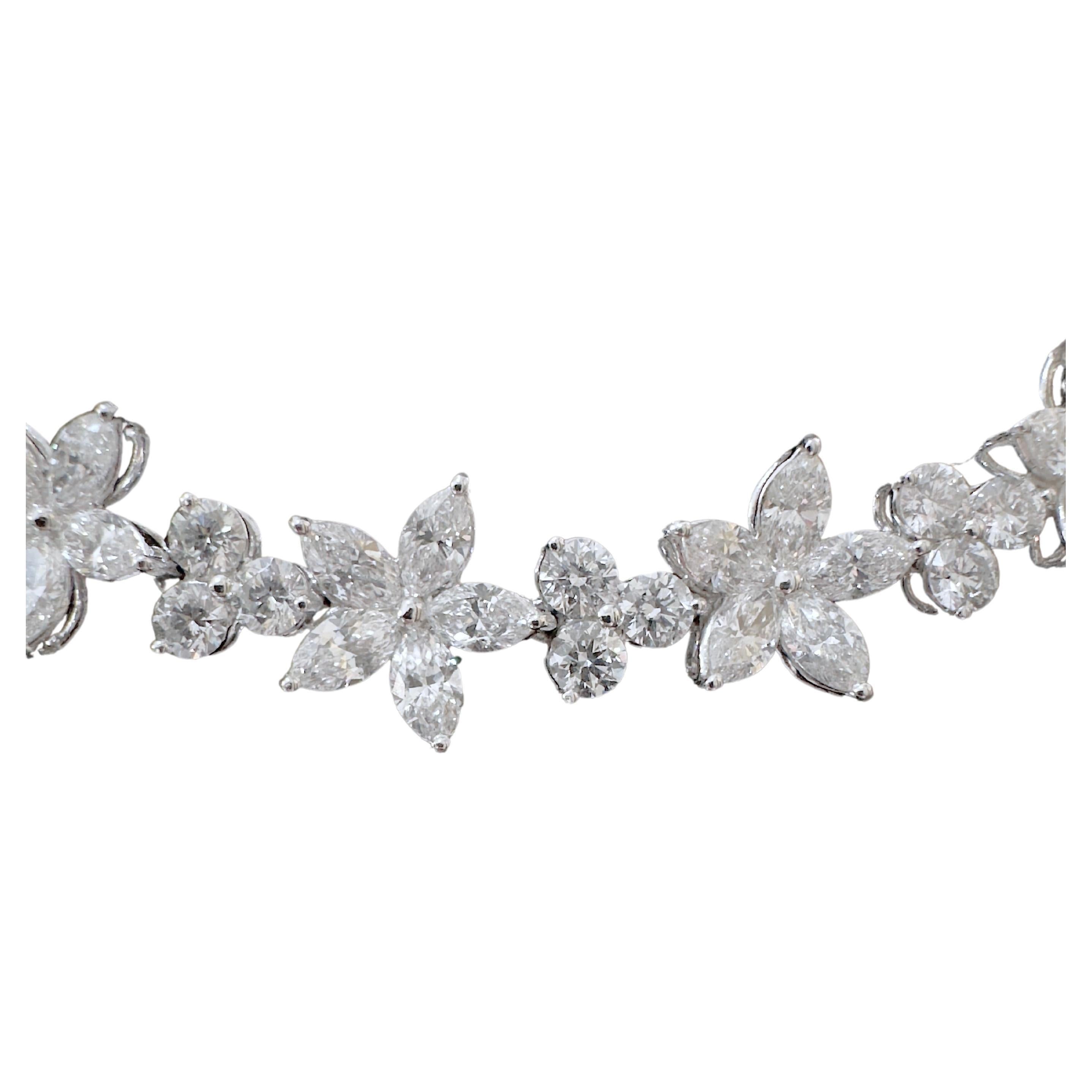 This magnificent wreath style necklace is an absolute must have for every jewelry collector and lover.  It is timeless iconic and elegant that will captivate everyone's attention.  Set in 18k White Gold, the marquise diamond are arranged in a star