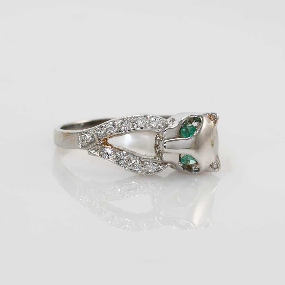 18K White Gold Diamond & Emerald Cat Ring
Stamped 18k and weighs 4 grams
SIZE 6 3/4
The Ring can be sized up or down one size for extra fee
There are 10 Diamonds with a total carat weight of .20ct
E-F Color, vs1-vs2 Clarity 
Two Small Emeralds for