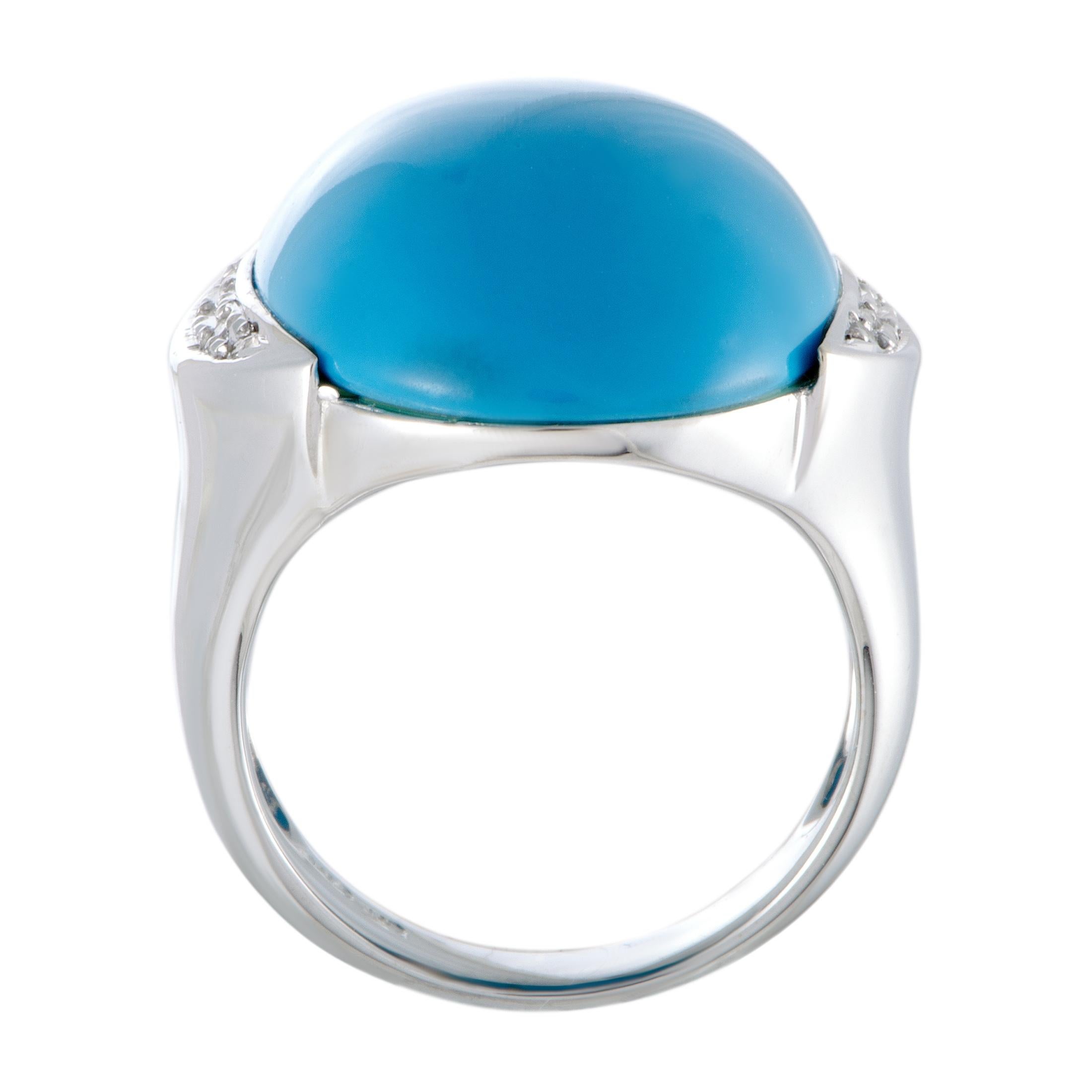 The sublime allure of the exquisitely cut turquoise steals the show in this fabulous ring that boasts a compellingly fashionable appeal. The ring is made of elegant 18K white gold and is also set with 0.08 carats of diamond stones.
Ring Top