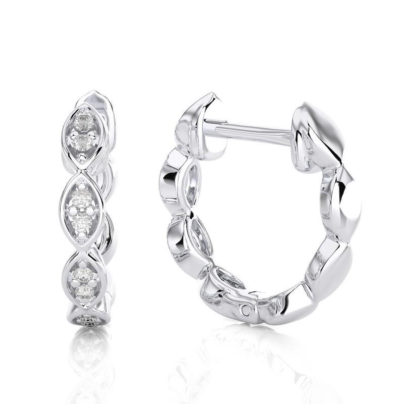 Experience timeless elegance with our 18K White Gold Diamonds Huggie Earrings, graced by a total of 0.07 carats across sixteen exquisite diamonds. These huggie earrings epitomize classic sophistication and contemporary allure.

Meticulously crafted