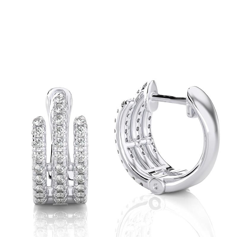 Elevate your style with our 18K White Gold Diamonds Huggie Earring, featuring a captivating 0.40 CTW of brilliant diamonds. Crafted in the warm embrace of white gold, this earring exudes timeless charm and modern sophistication. Its huggie design