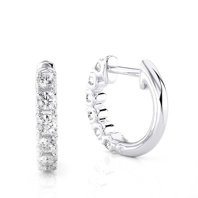 Elevate your style with these 18K White Gold Diamonds Huggie Earrings, adorned with a total of 0.46 carats of dazzling diamonds. Crafted with precision, these huggie earrings feature a sleek, contemporary design in lustrous 18K white gold. The white