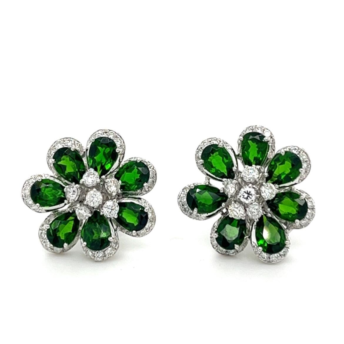 18K White Gold Diopside Stud Earrings with Diamonds

14 Diopsides - 5.93 CT
82 Diamonds - 1.35 CT
18K Gold - 6.08 GM

These stunning earrings feature a collection of richly-colored diopside gemstones, perfectly complemented by sparkling diamonds.