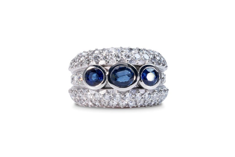 A beautiful 3 stone sapphire ring with diamond side stones made from 18k white gold with 4.70 total carat of oval sapphires and round brilliant diamonds. This ring comes with an IGI report and a fancy box.

-3 sapphire main stone of 0.567 ct. each,