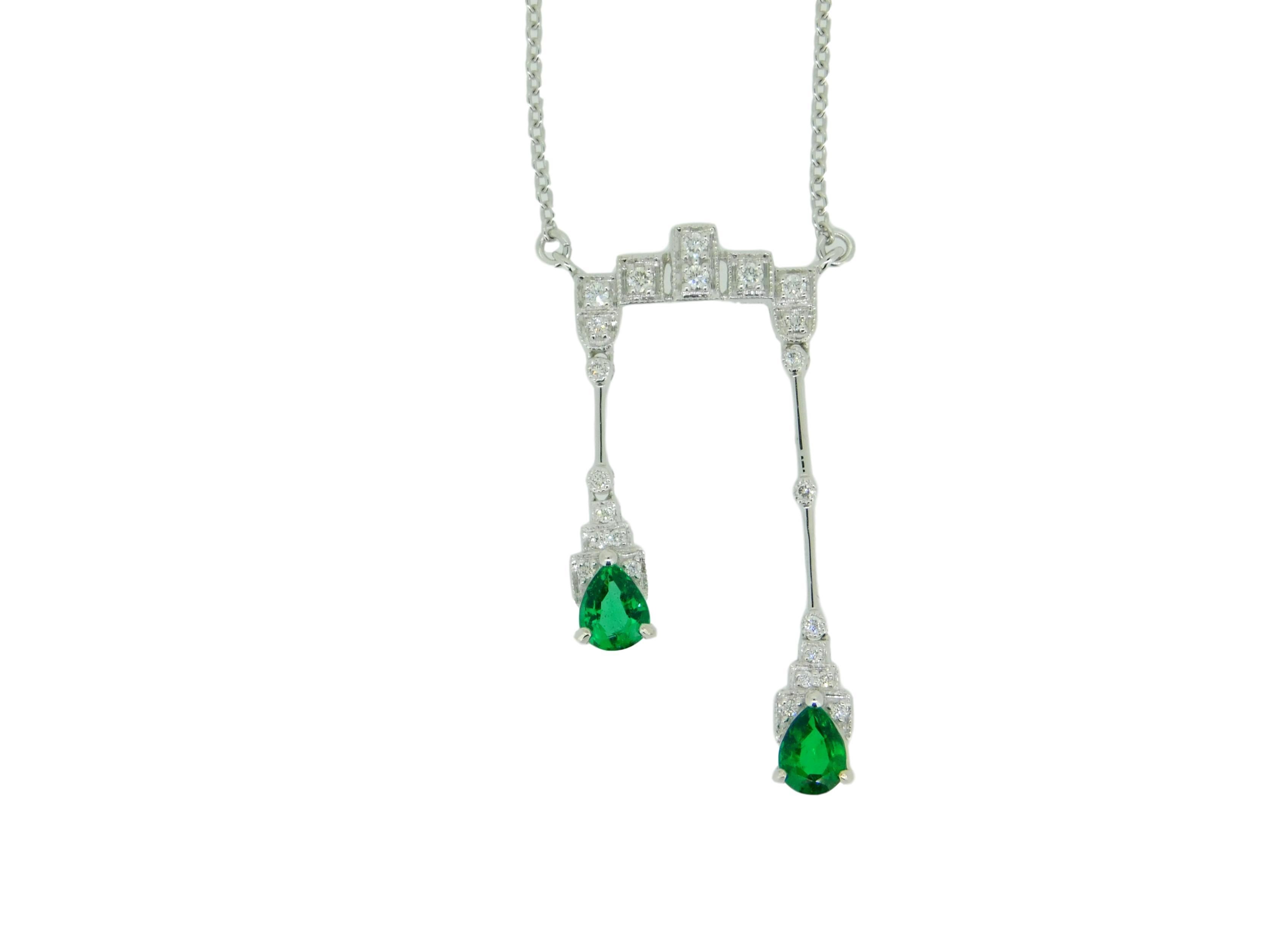 18k White Gold Double Drop Genuine Natural Emerald and Diamond Necklace (#J4715)

18k white gold necklace featuring two drops with pear shape emeralds weighing .57cts total. The emeralds are fine quality and have medium dark green color. The