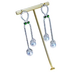 18K White Gold Drop Earrings with 2.30ct Diamonds 
1.20ct Emeralds