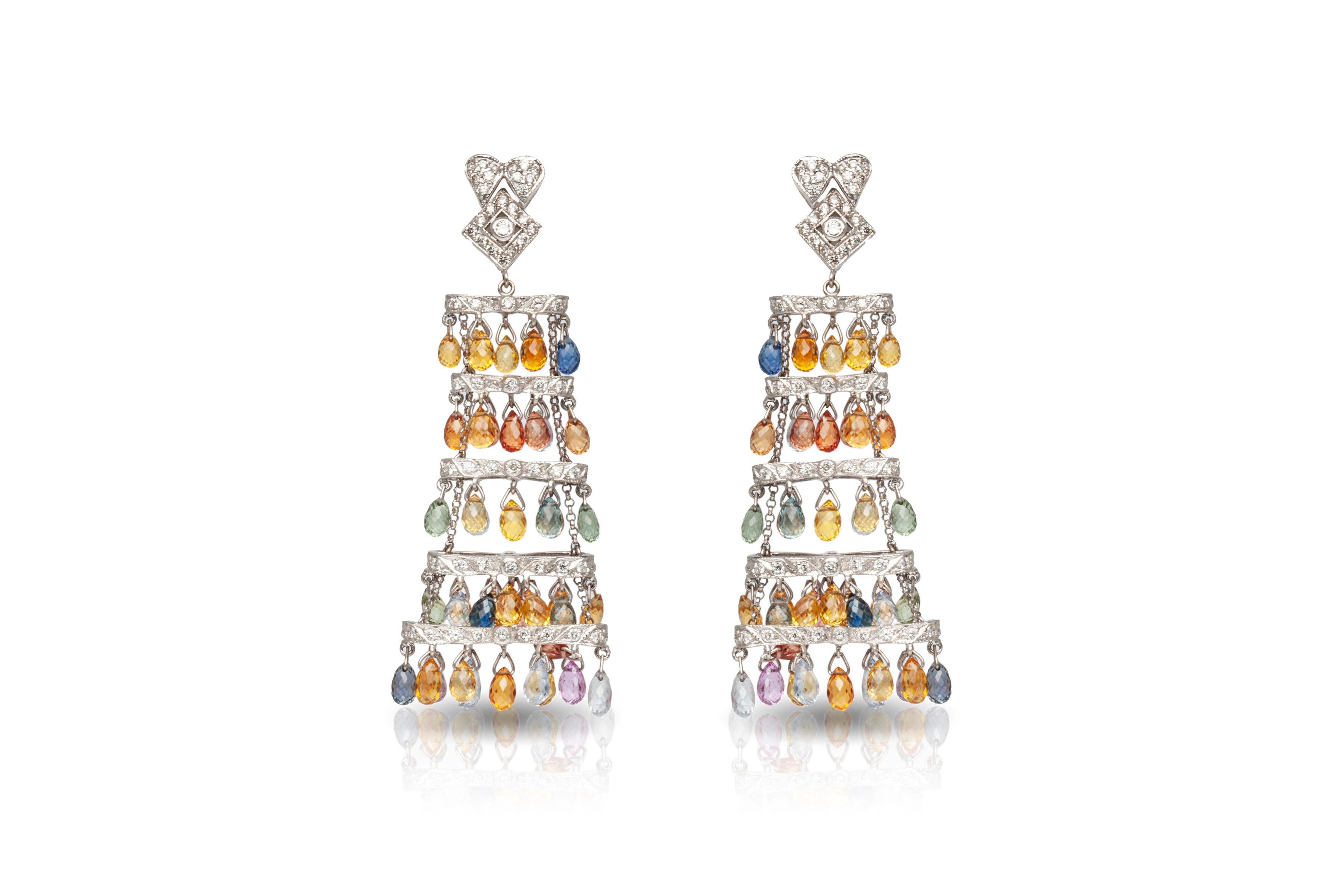 The earrings is finely crafted in 18k white gold with colors of sapphires weighing total of 39.10 carat and diamonds weighing approximately total of 2.50 carat.
