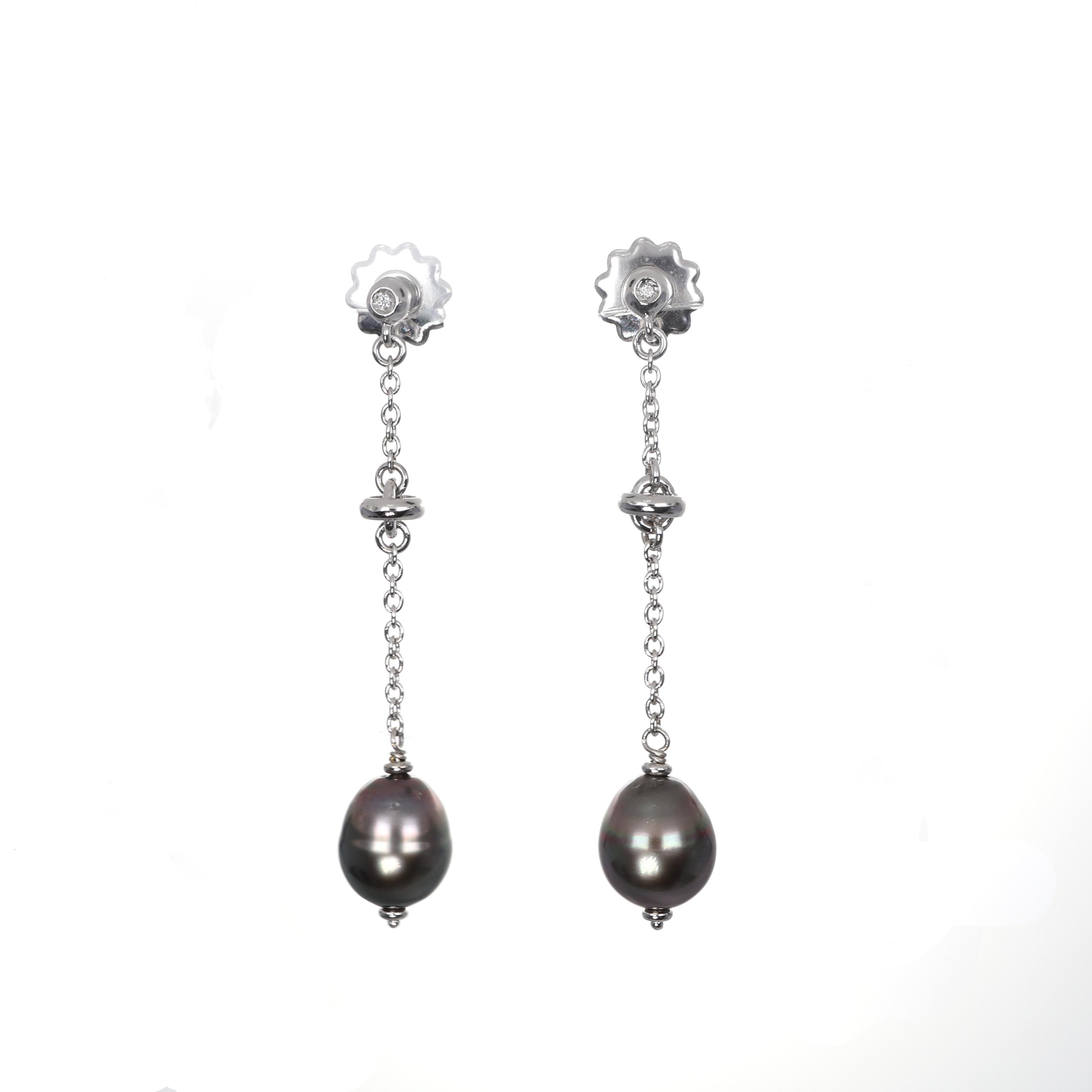 Refined drop earrings crafted in 18K white gold, featuring delicate diamonds totaling 0.02 carats and lustrous pearls. The elegant chain design enhances movement, making them a timeless addition to any collection.

Key Features:

18K white